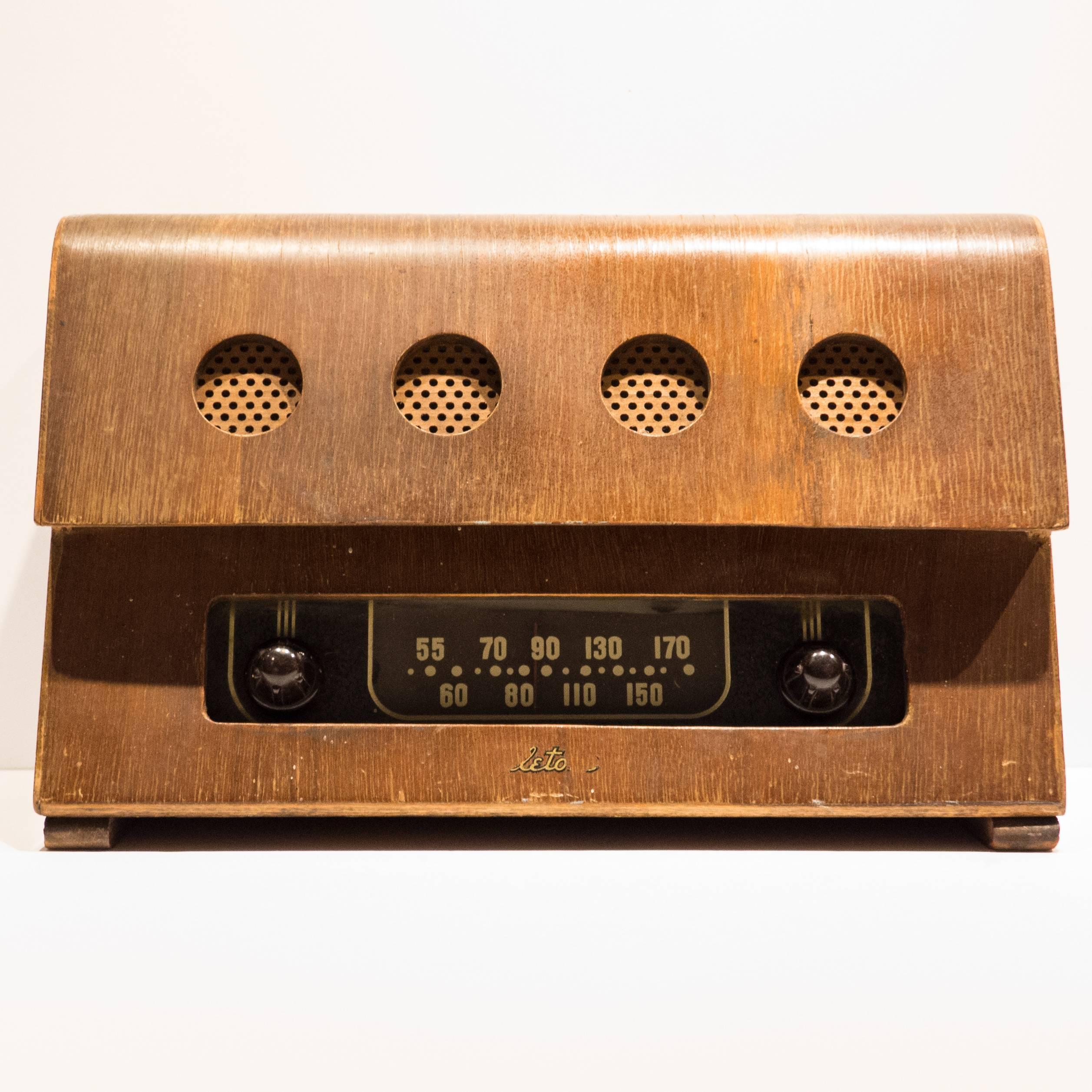 Radio of molded and cut walnut plywood, bakelite, glass and perforated masonite. Designed by Charles and Ray Eames and produced by Evans Products for Teletone, circa 1946. As Richard Wright noted in 2004, 