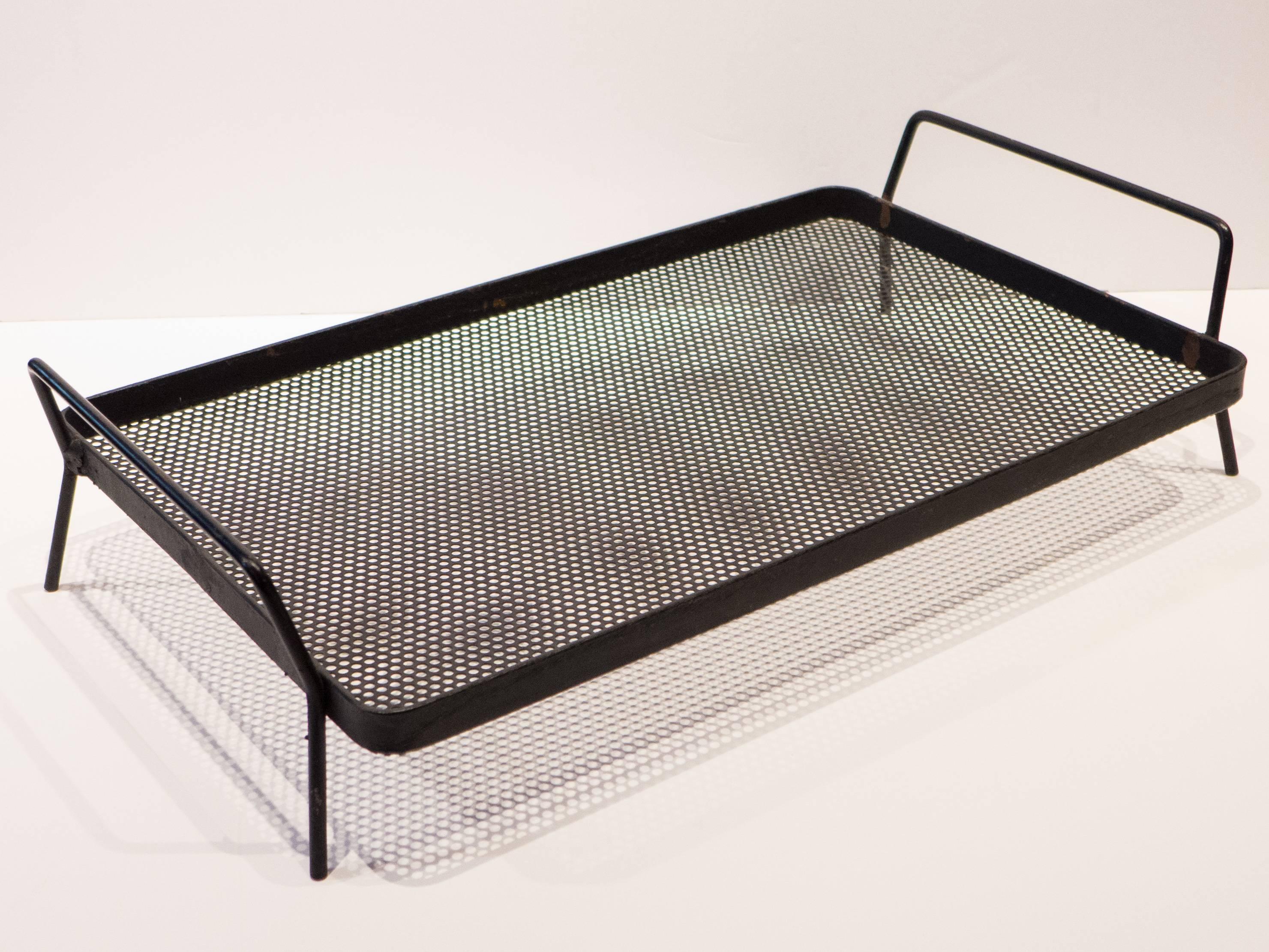 Footed tray of wrought iron and perforated metal by industrial and landscape designer Richard Galef, produced by Ravenware, circa 1952. The tray itself measures 18