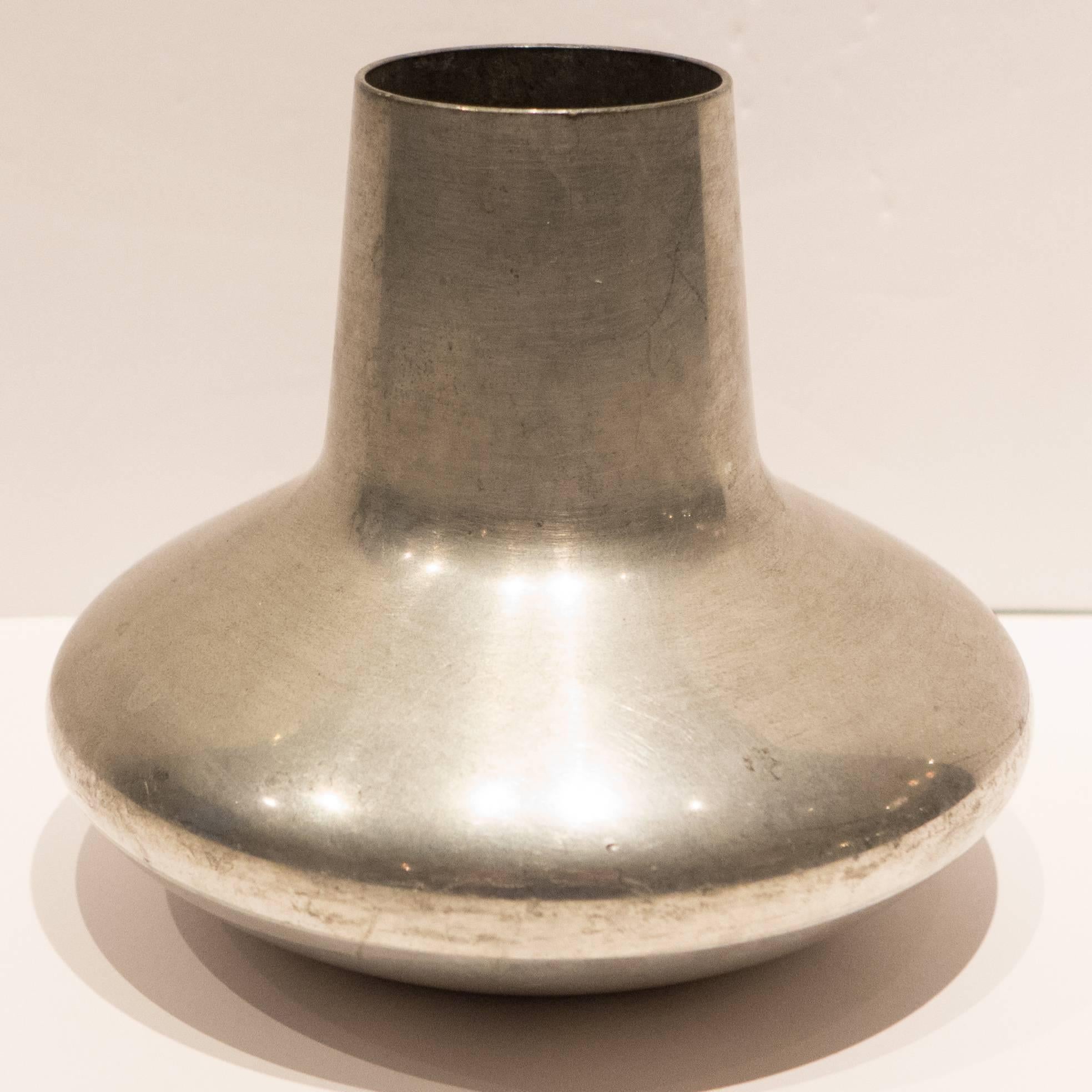 Pewter vase with a sculpturally Minimalist bearing designed by Henning Koppel and produced for Georg Jensen, circa 1950s. Marked 