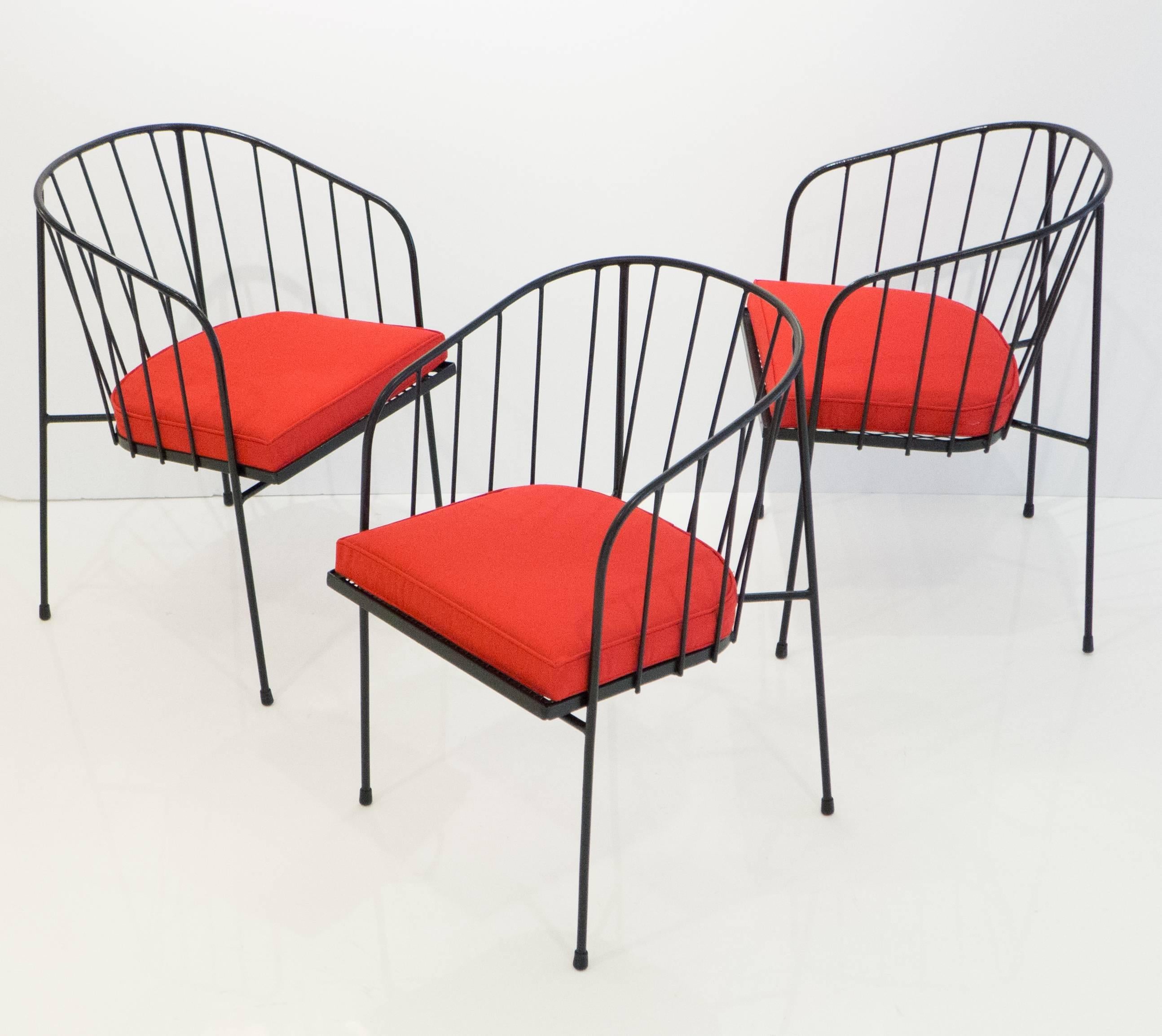 Set of three wrought iron outdoor chairs designed by George Nelson and produced by Arbuck for a brief period in 1951-1952, and so rare to the market. The front legs and backrest are one wraparound piece, with welded back legs. The mesh seat is