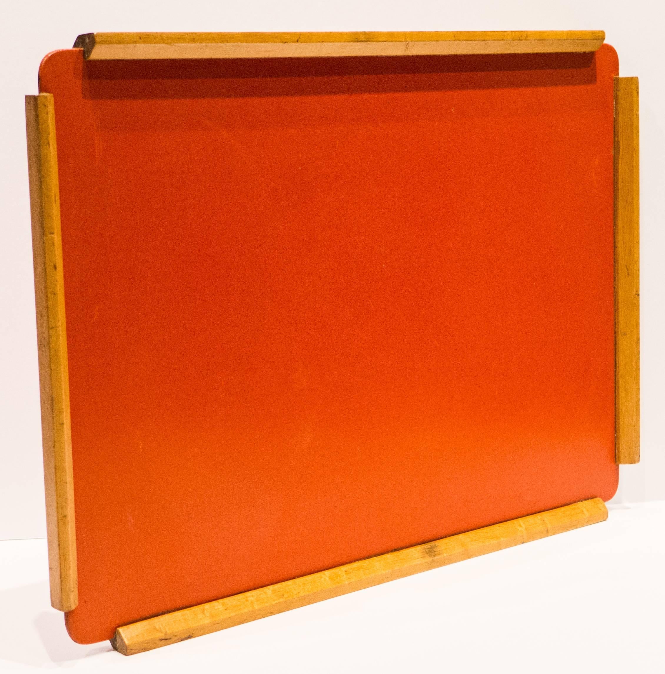 Medium-sized serving tray of red Masonite (fiberboard) with birch edging. Designed and produced by Boston-area designer Franziska Hosken, circa 1948. One of the first women to graduate from the Harvard School of Design, Hosken operated a small