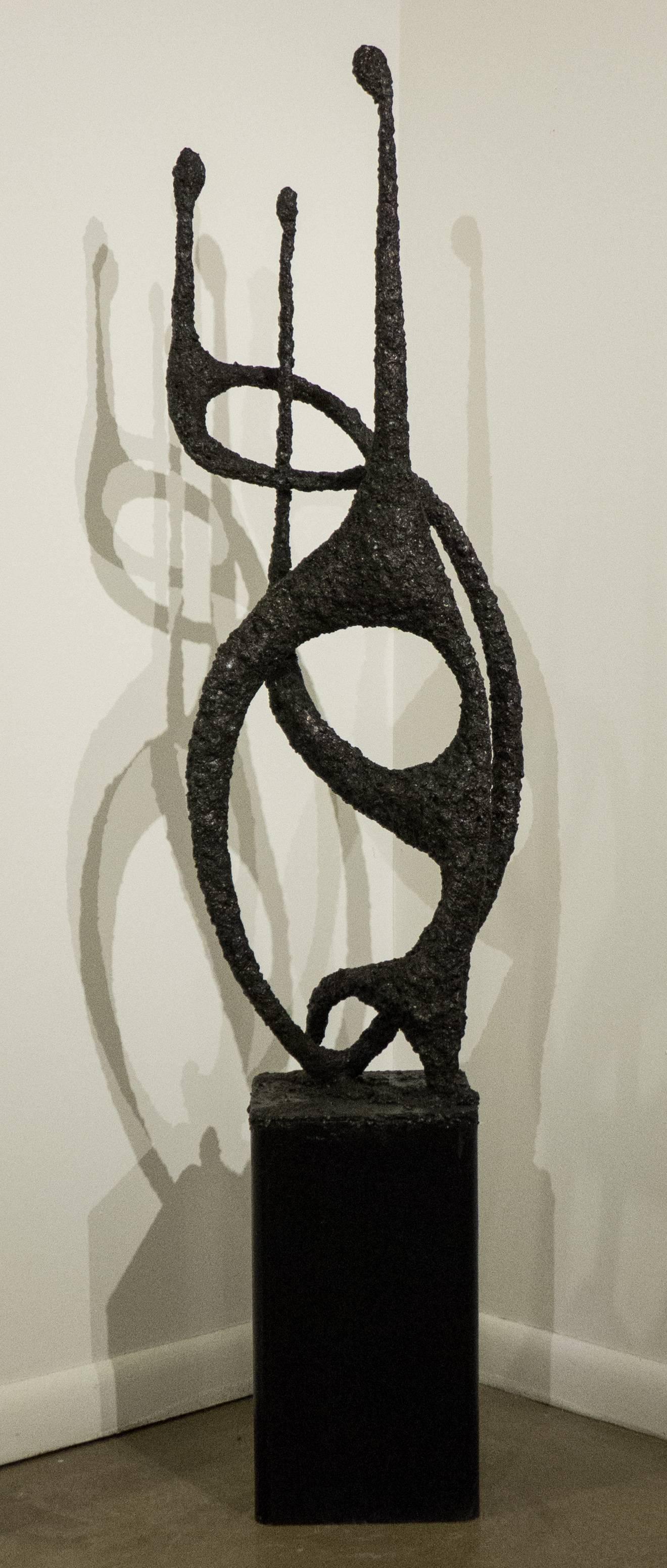 Tall Brutalist figural abstract sculpture, titled 