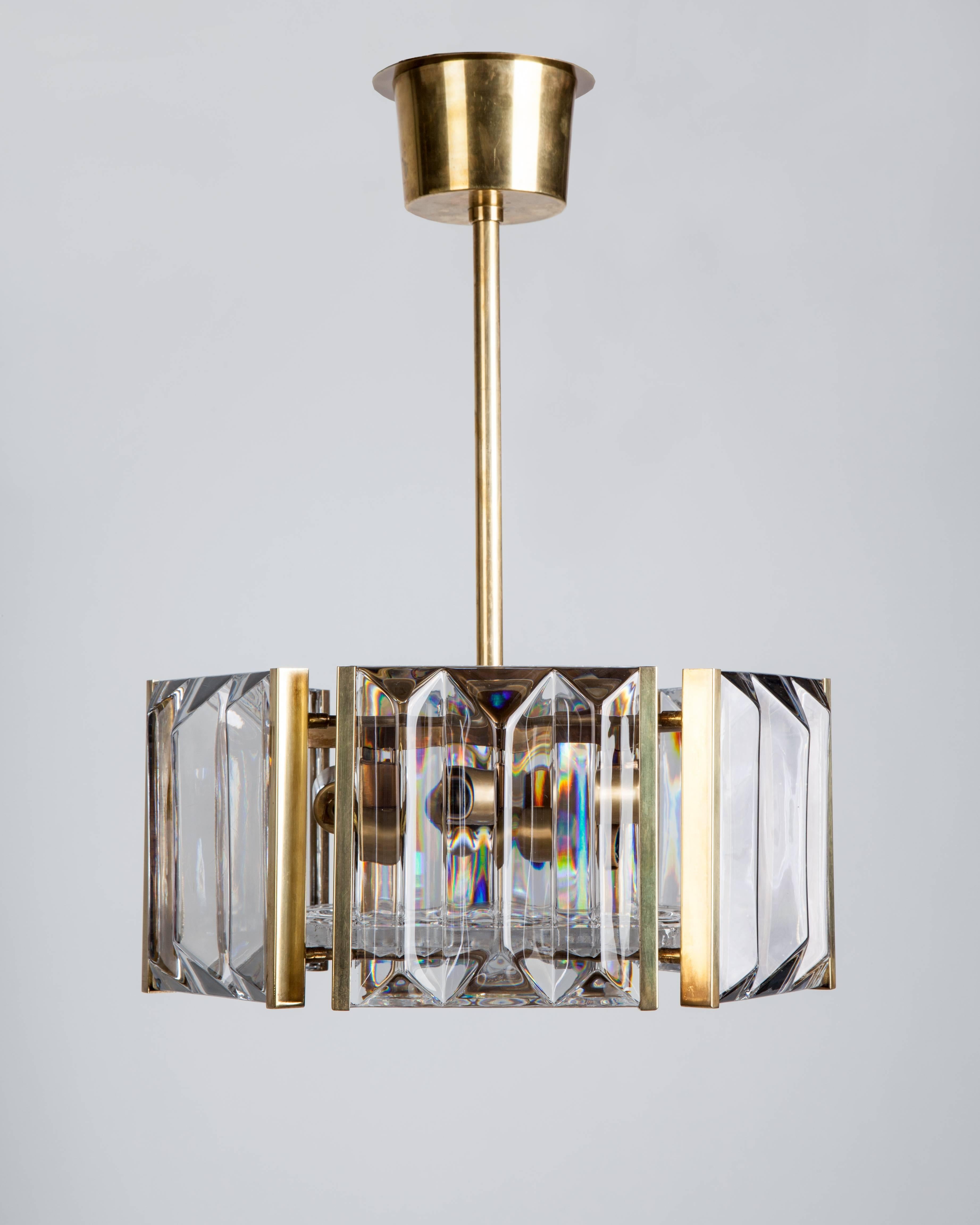 AHL3941

A hexagonal pendant, each face of the solid brass frame holding a faceted crystal block. Designed by Carl Fagerlund for the Swedish glassmaker Orrefors. Due to the antique nature of this fixture, there may be some nicks or imperfections