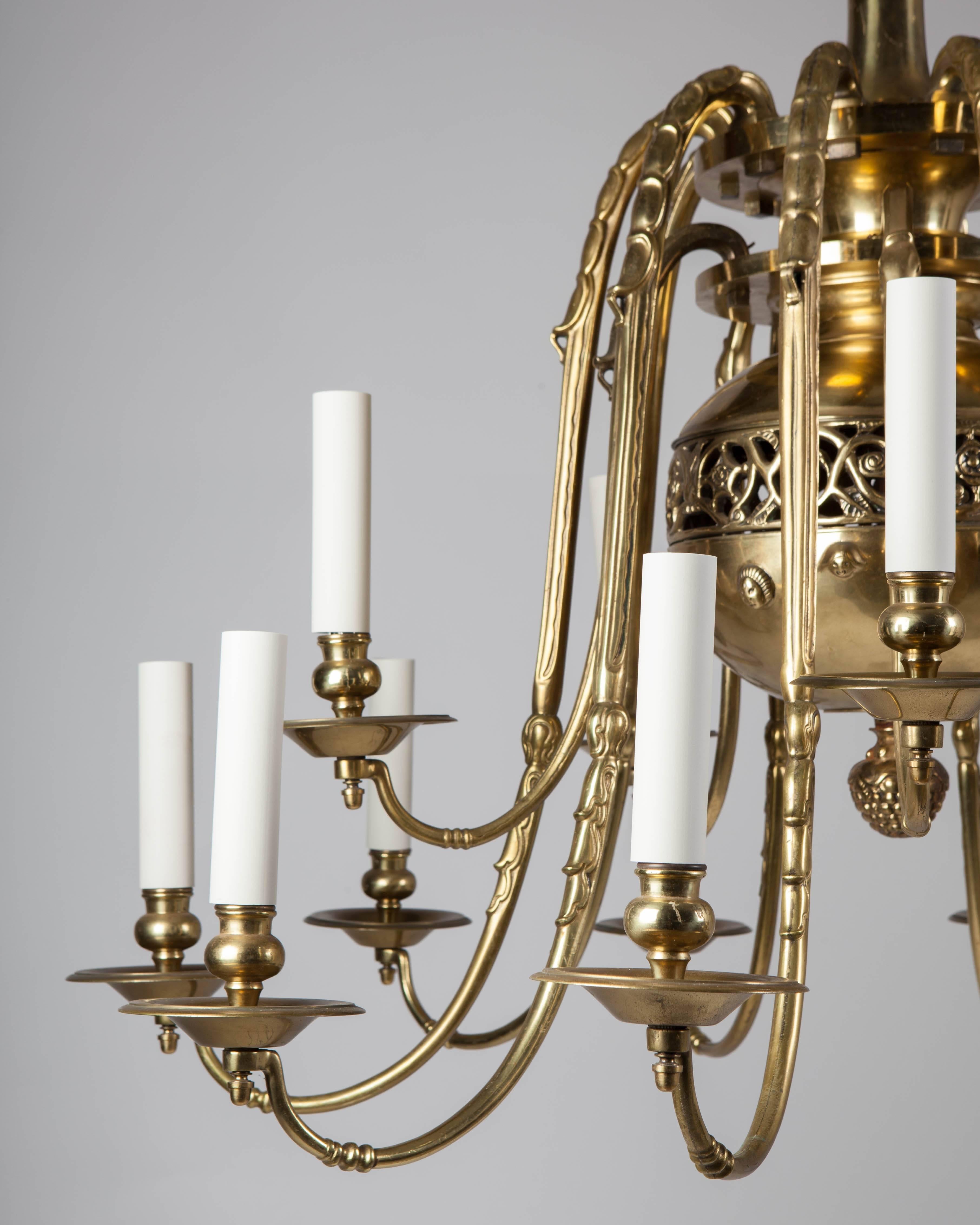 AHL3936.
An antique bronze chandelier with fifteen arms descending in two tiers from the pierced, baluster-form body. From a Cherry Hill, PA. estate.

Dimensions:
Current height: 60