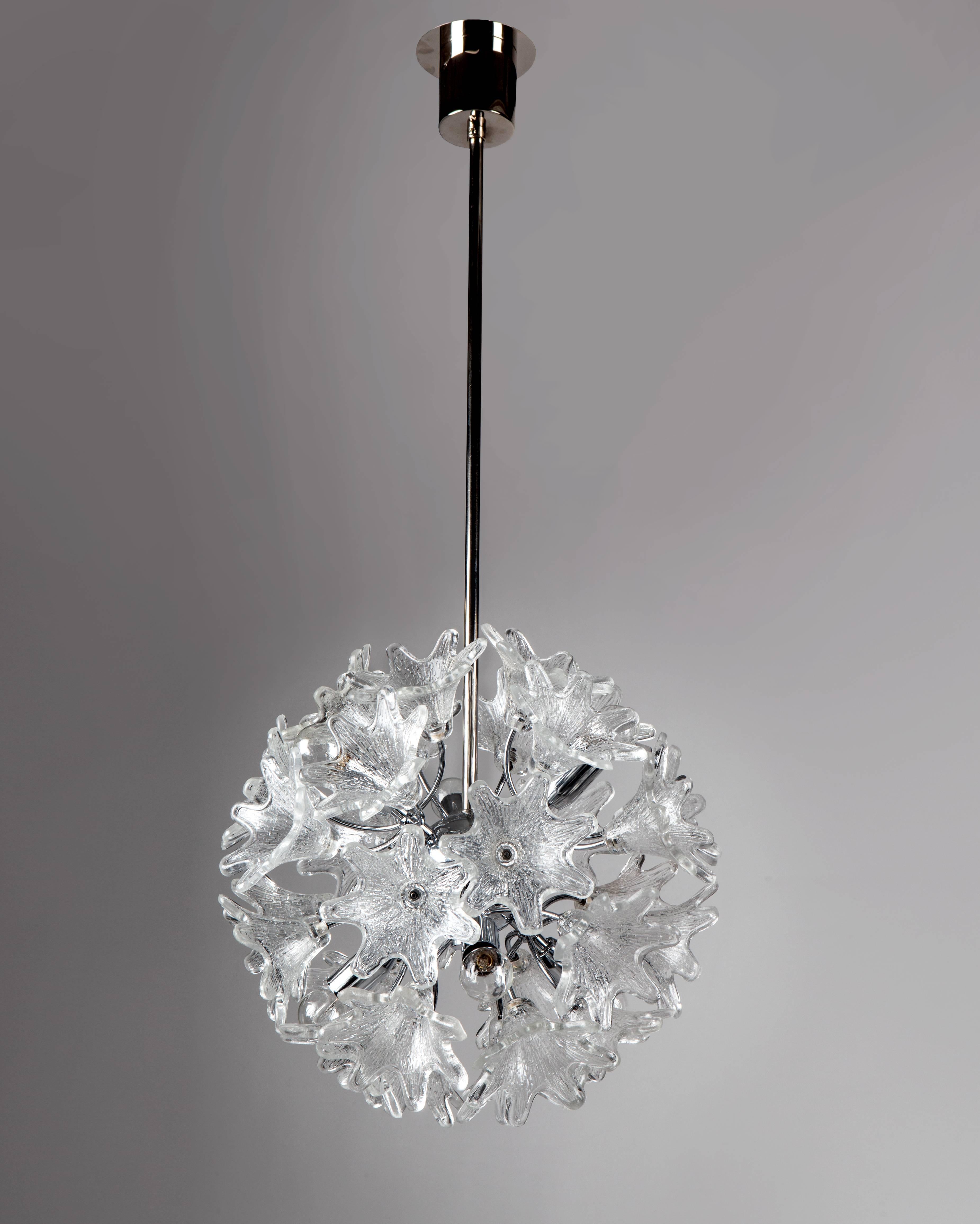 AHL3980
A vintage Sputnik chandelier with three-dimensional foliate glass pieces on a chrome and nickel frame. This mid-century modern fixture was designed by Venini for the italian maker VeArt. Due to the antique nature of this fixture, there are