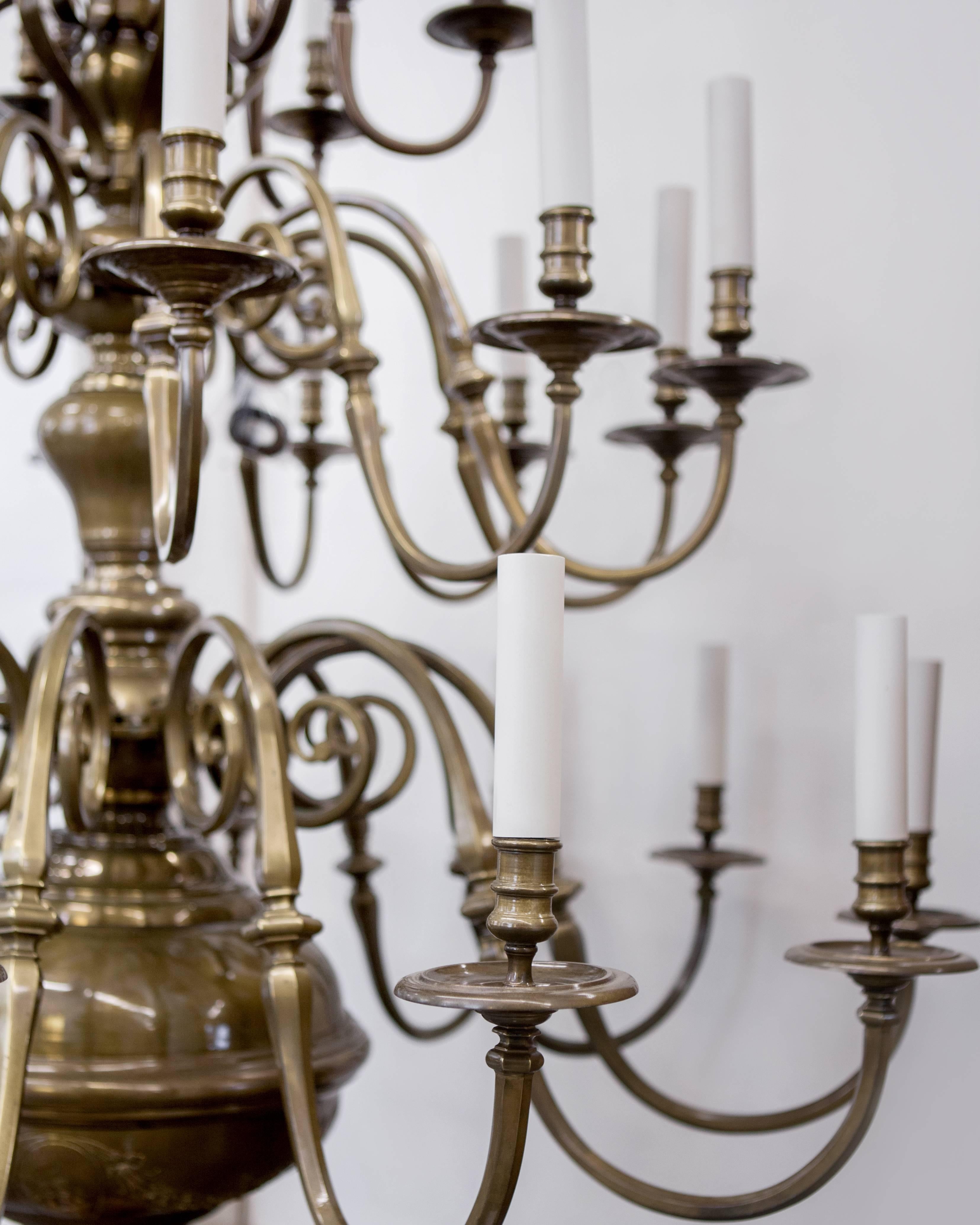 AHL3982

A large, three-tier, thirty-arm chandelier by the New York Maker E. F. Caldwell that once hung at Harvard University's Dental School Dining Hall. The large baluster-form body is detailed with repousse Harvard emblems. The S-profile arms