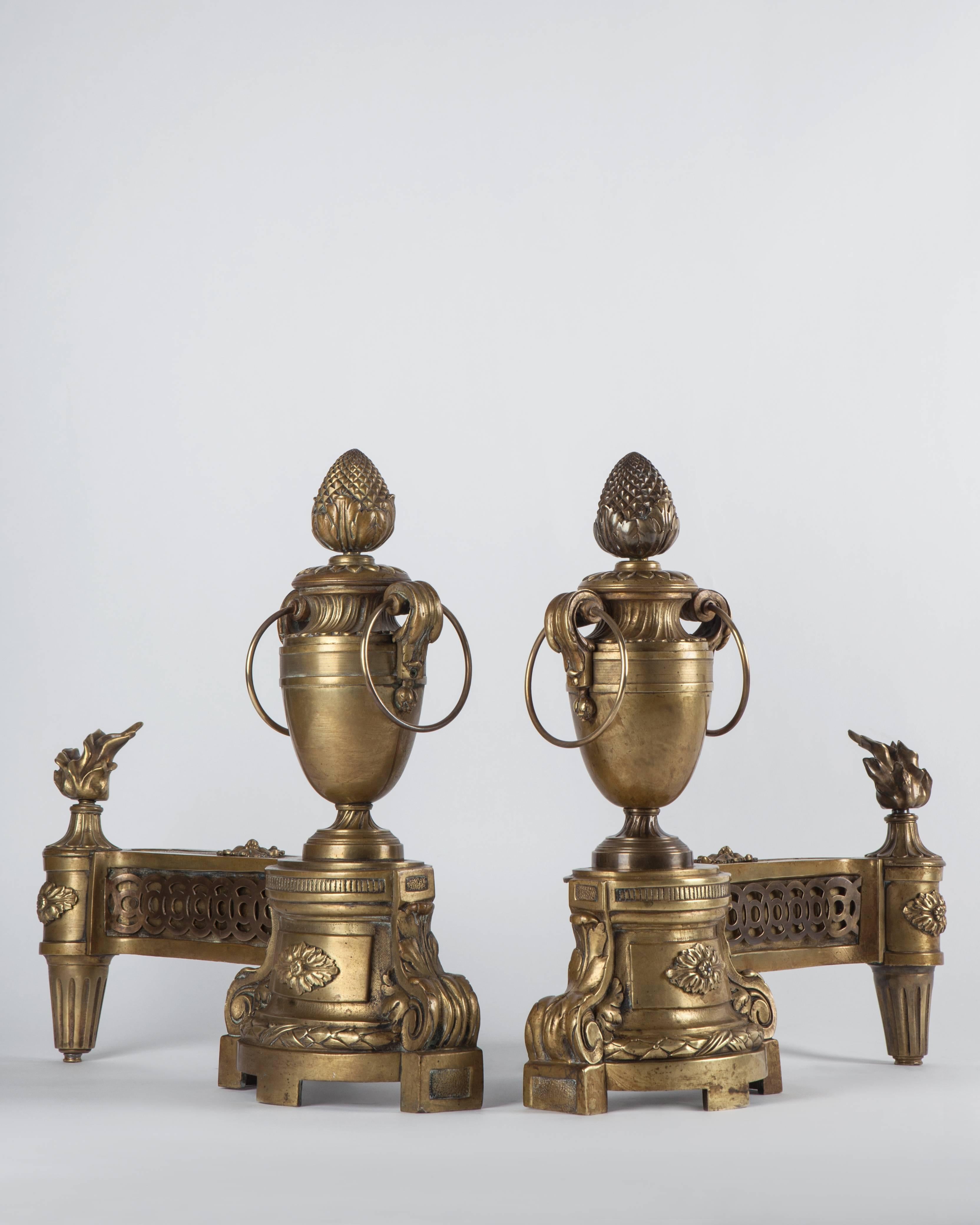 Mid-19th Century French Urn Form Chenets with Flame and Pinecone Finials in Aged Brass, c. 1860s For Sale