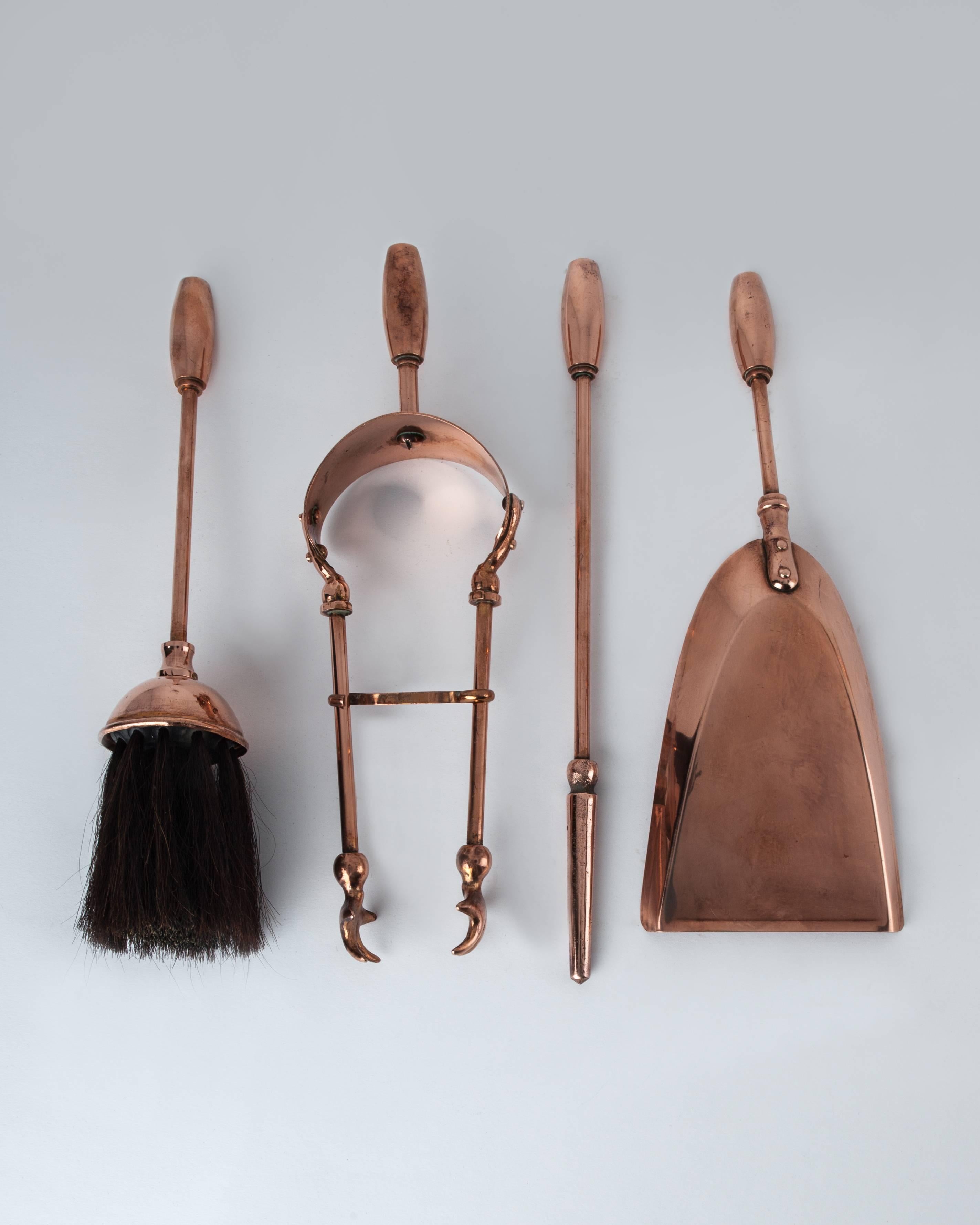 AFP0516
A four-piece copper fireplace tool set including a pair of tongs, poker, brush, and shovel hanging on a matching stand.

Dimensions:
Overall: 14-1/2