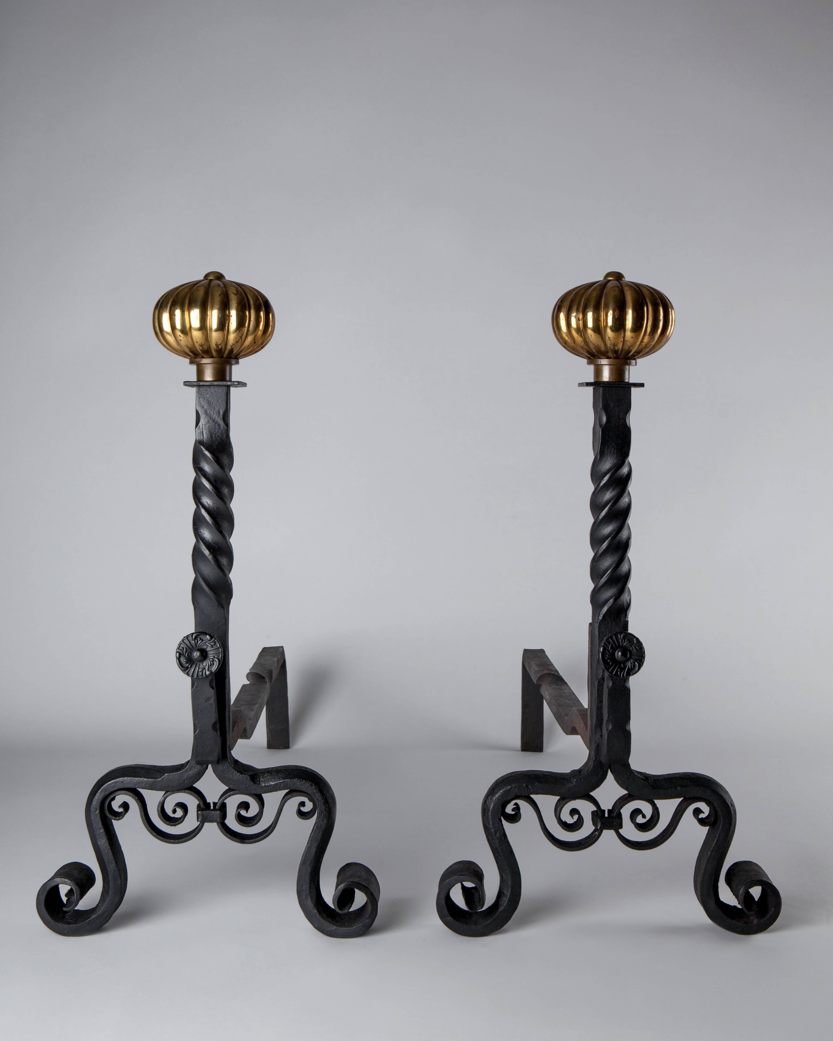 AFP0519.
A pair of antique andirons with wrought iron bodies and gadrooned knob finials in their original aged brass finish.

Dimensions:
Overall: 20-3/4