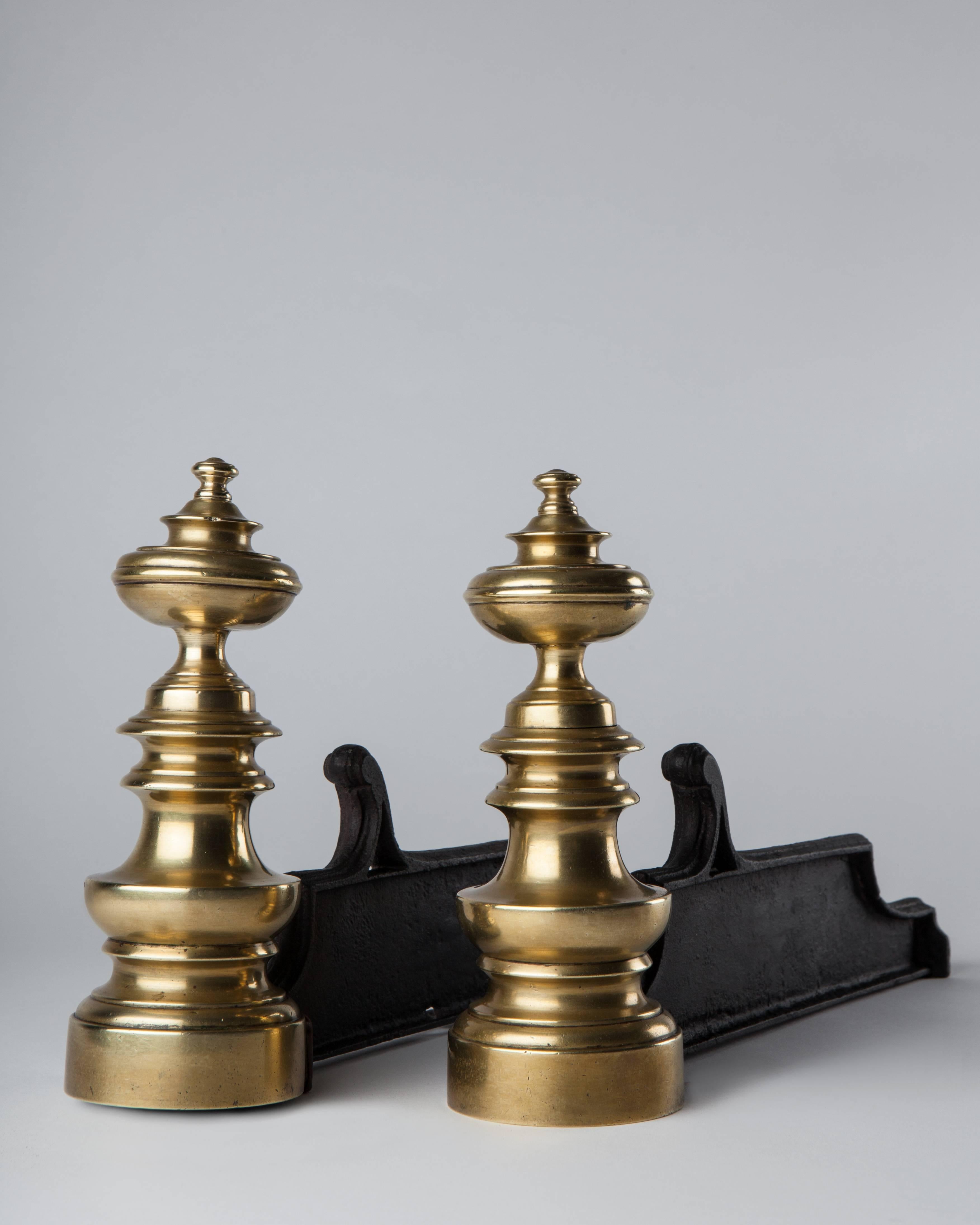 A pair antique of brass and iron chenets with wide sculptural turnings,
circa 1900.

Dimensions:
Overall: 8