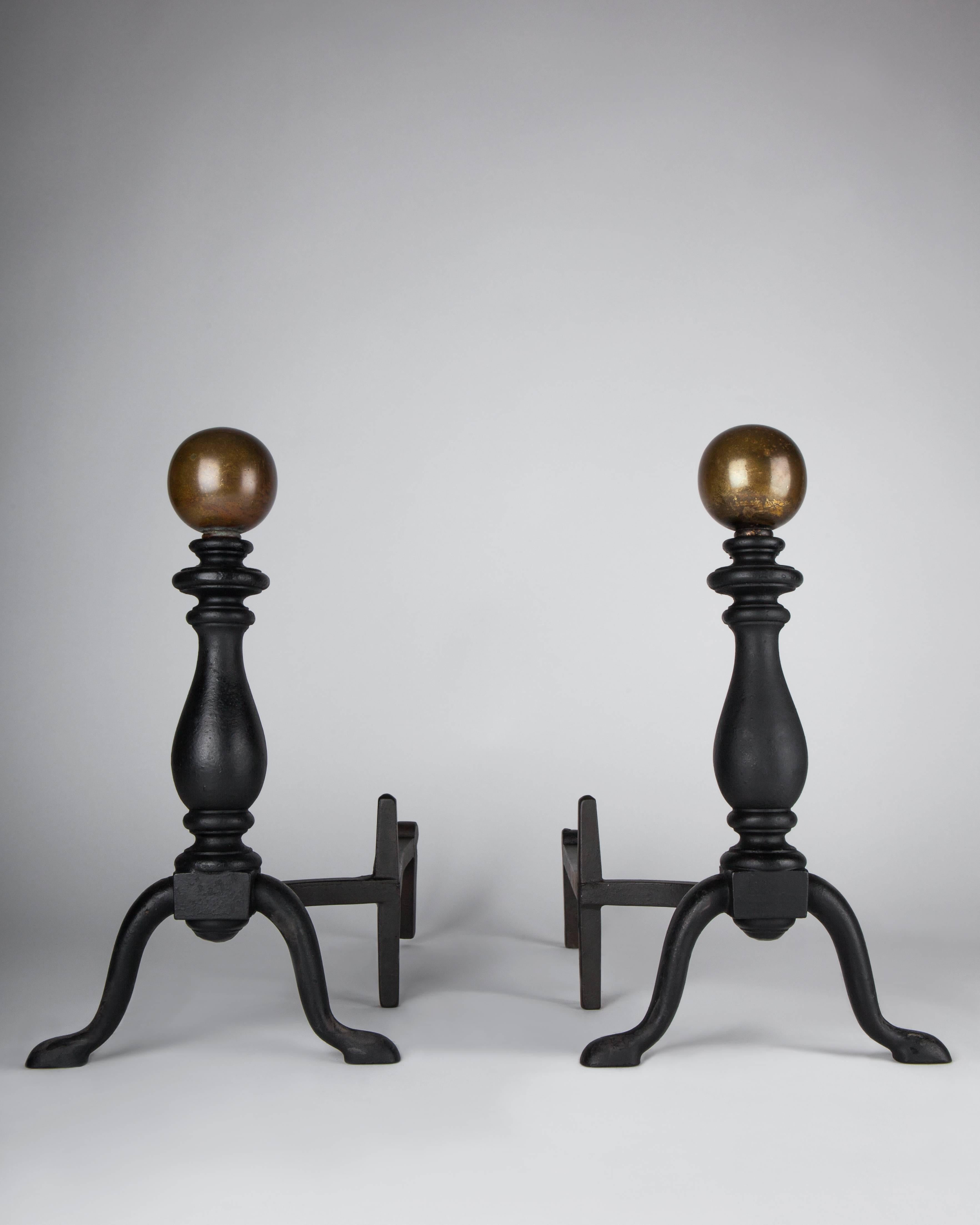 AFP0523,
A pair of antique blackened iron andirons with simple brass ball finials in their original aged patina.

Dimensions:
Overall: 17-1/2