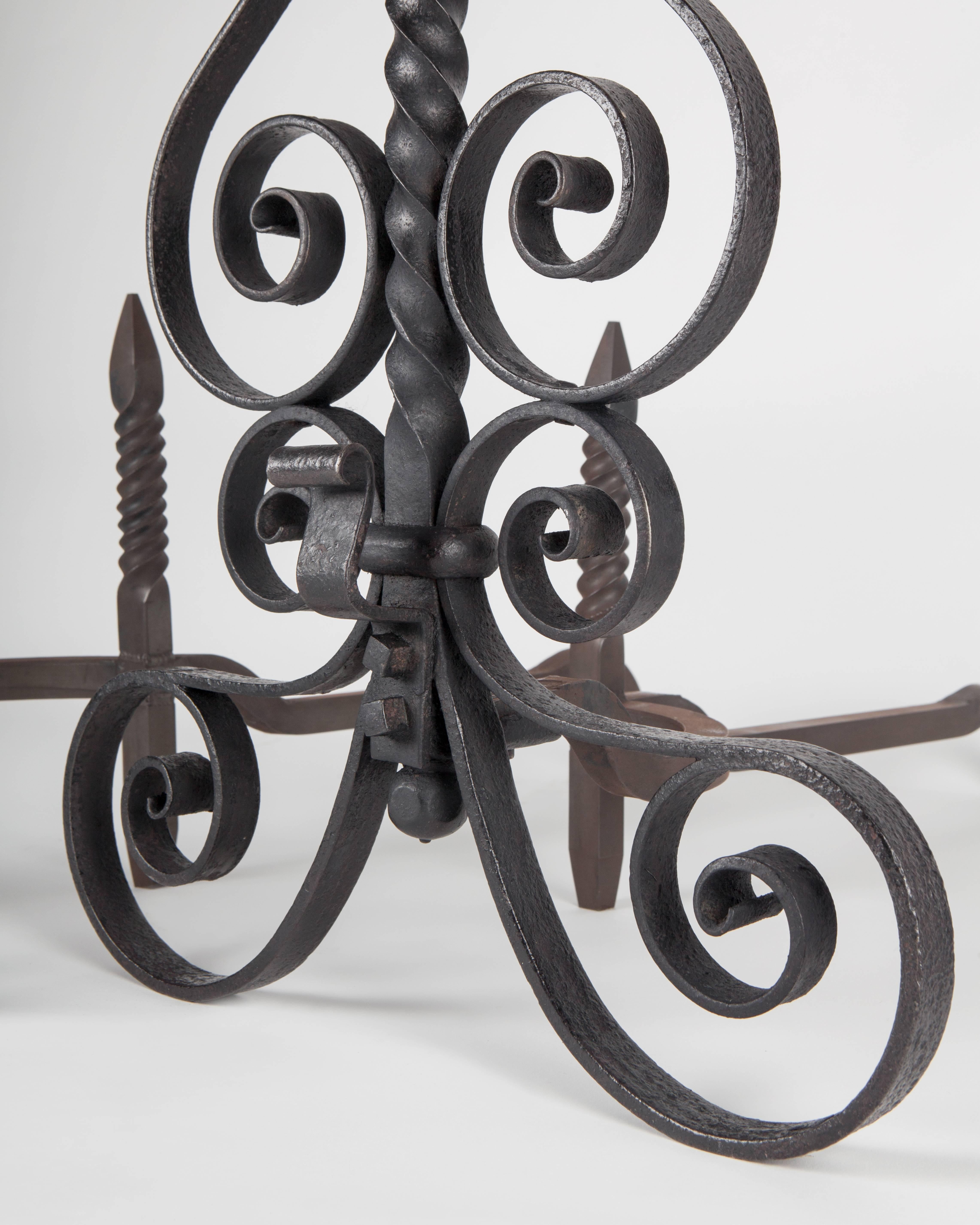 Blackened Wrought Iron Andirons with Scrolls and Twisted Central Fender Crossbar, c. 1880s For Sale