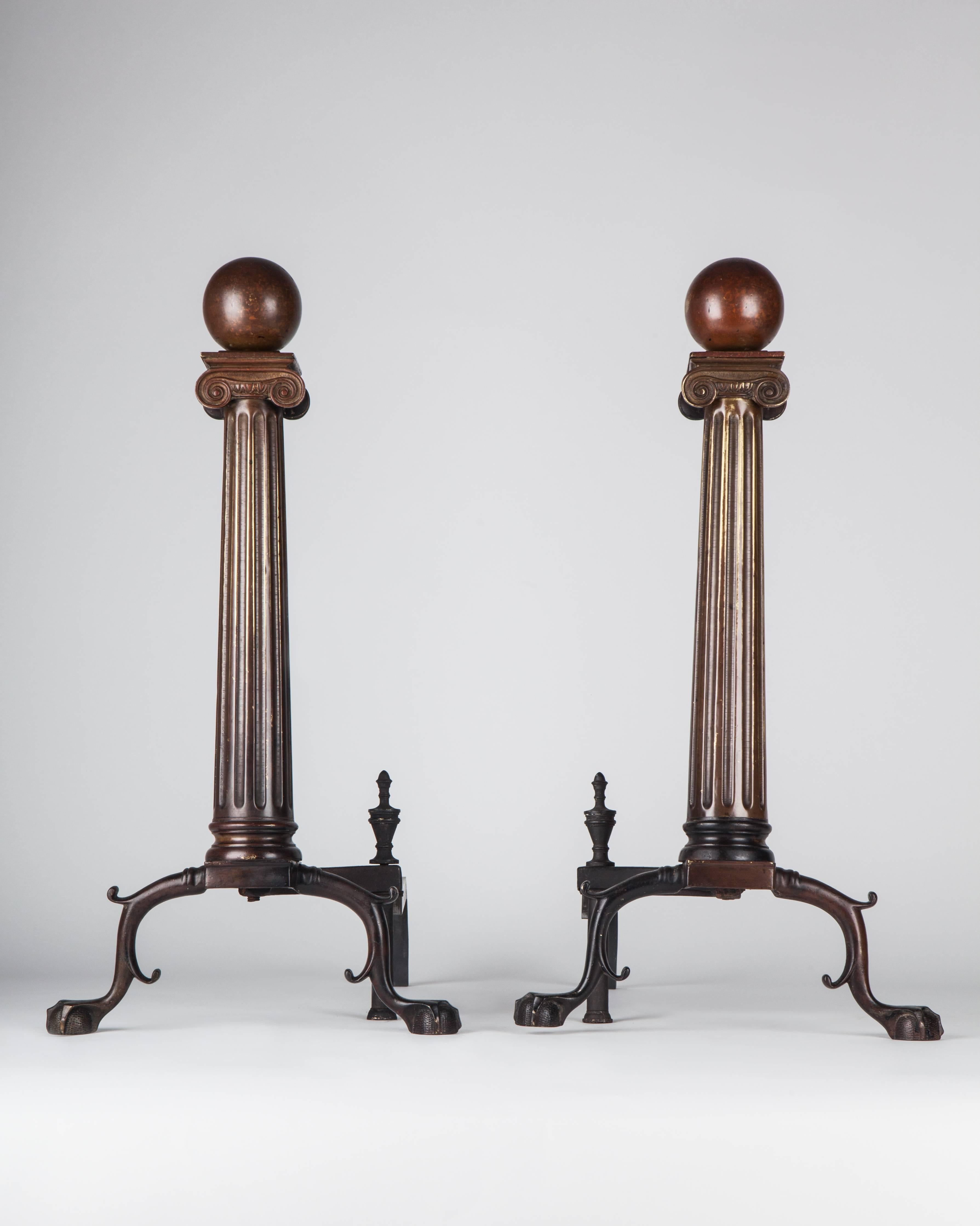 AFP0542
A pair of neoclassical ionic column-form andirons in their wonderful, original dark ruddy finish.

Dimensions:
Overall: 22