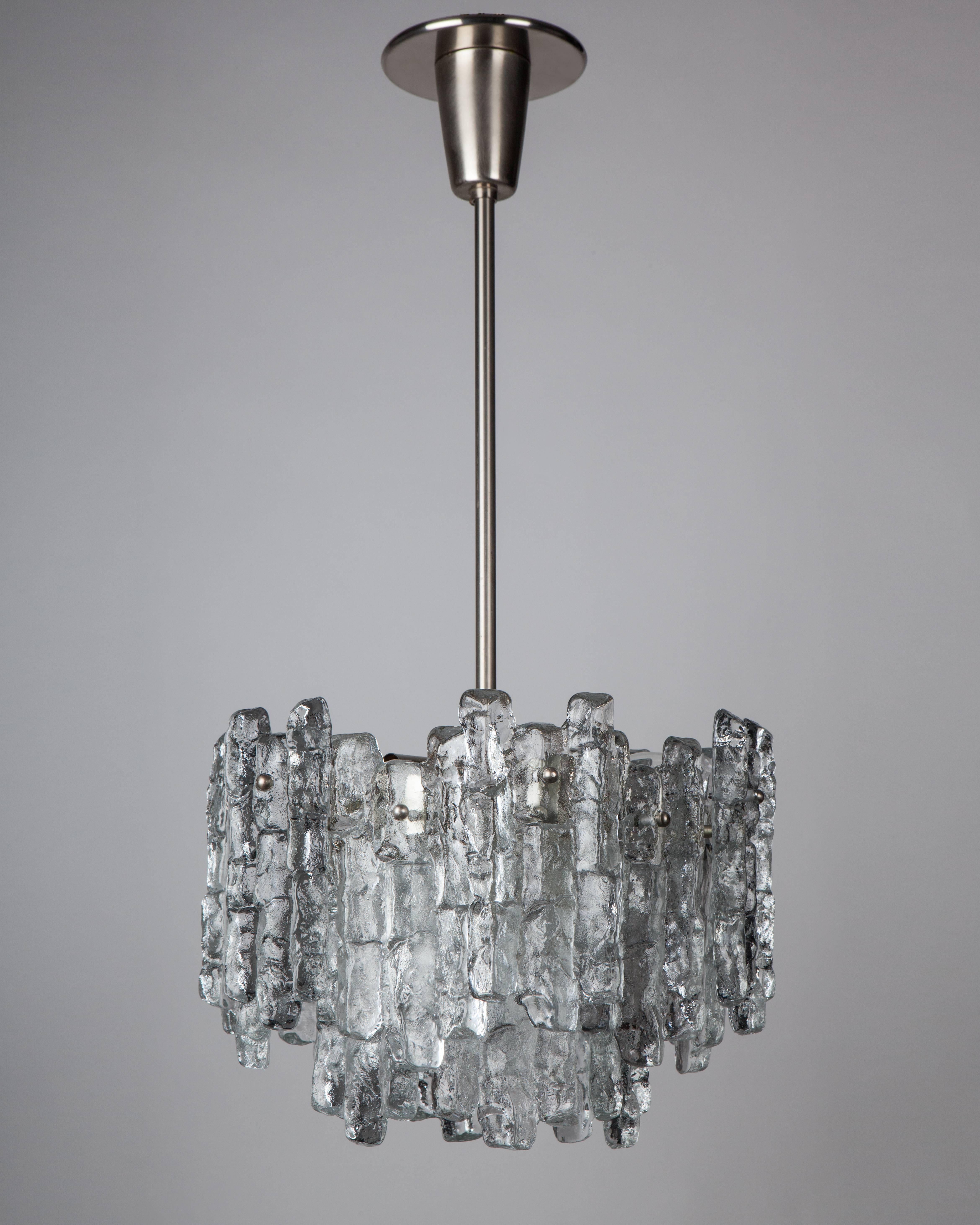 AHL4003.
A vintage chandelier with clear cast glass on a nickel frame. By the Austrian maker Kalmar. Due to the antique nature of this fixture, there may be some nicks or imperfections in the glass.

Dimensions:
Current height: 27