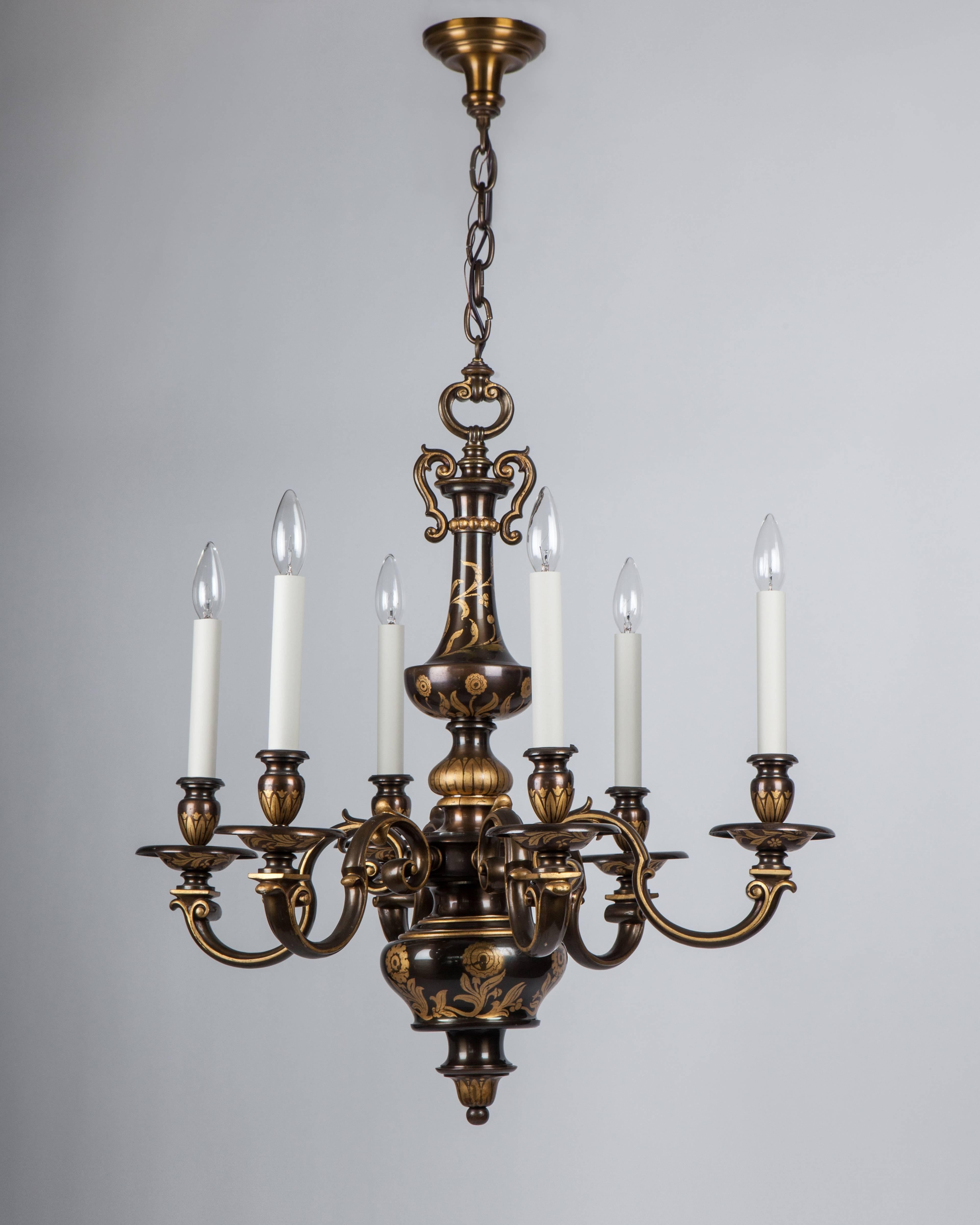 AHL4009,
a six-light cast bronze chandelier in its original dark patina finish with gilded foliate-form highlights.

Dimensions:
Current height: 57