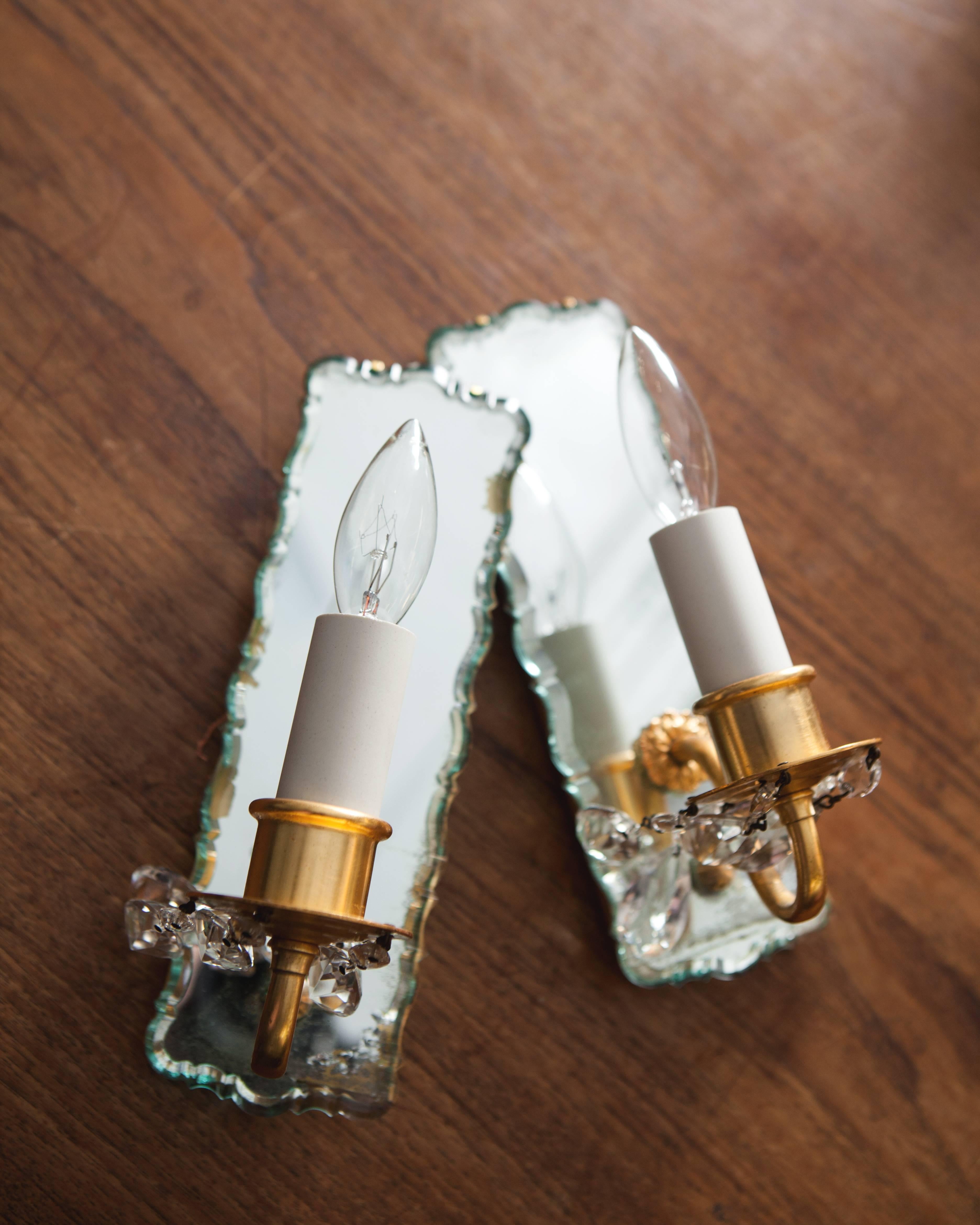 Slender mirrorback sconces dressed with prisms, circa 1950 In Good Condition In New York, NY