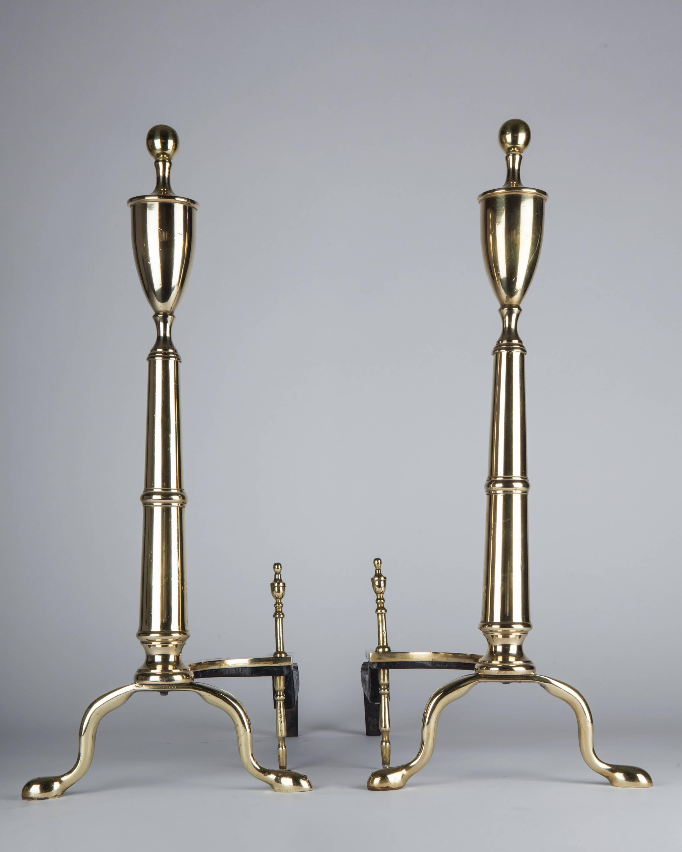 AFP0547 

A pair of antique brass andirons topped with urn finials and having pad feet in their original soft polished finish. Circa 1920s.

Dimensions: 
Overall: 24-1/2