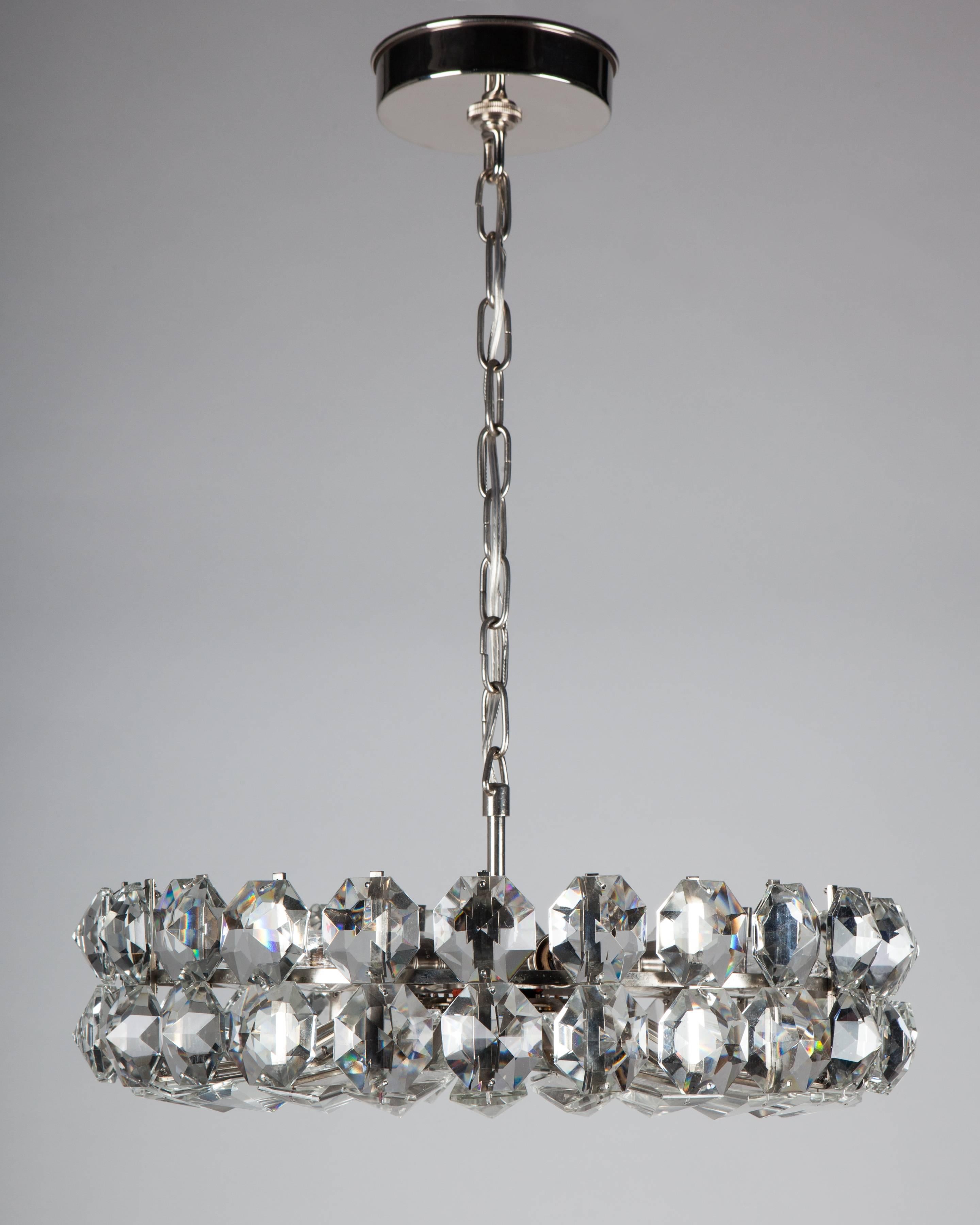AHL4068
A vintage six-light chandelier with faceted glass crystals on its original aged nickel frame. Attributed to the Austrian maker Bakalowitz & Soehne. Due to the antique nature of this fixture, there may be some nicks or imperfections in the