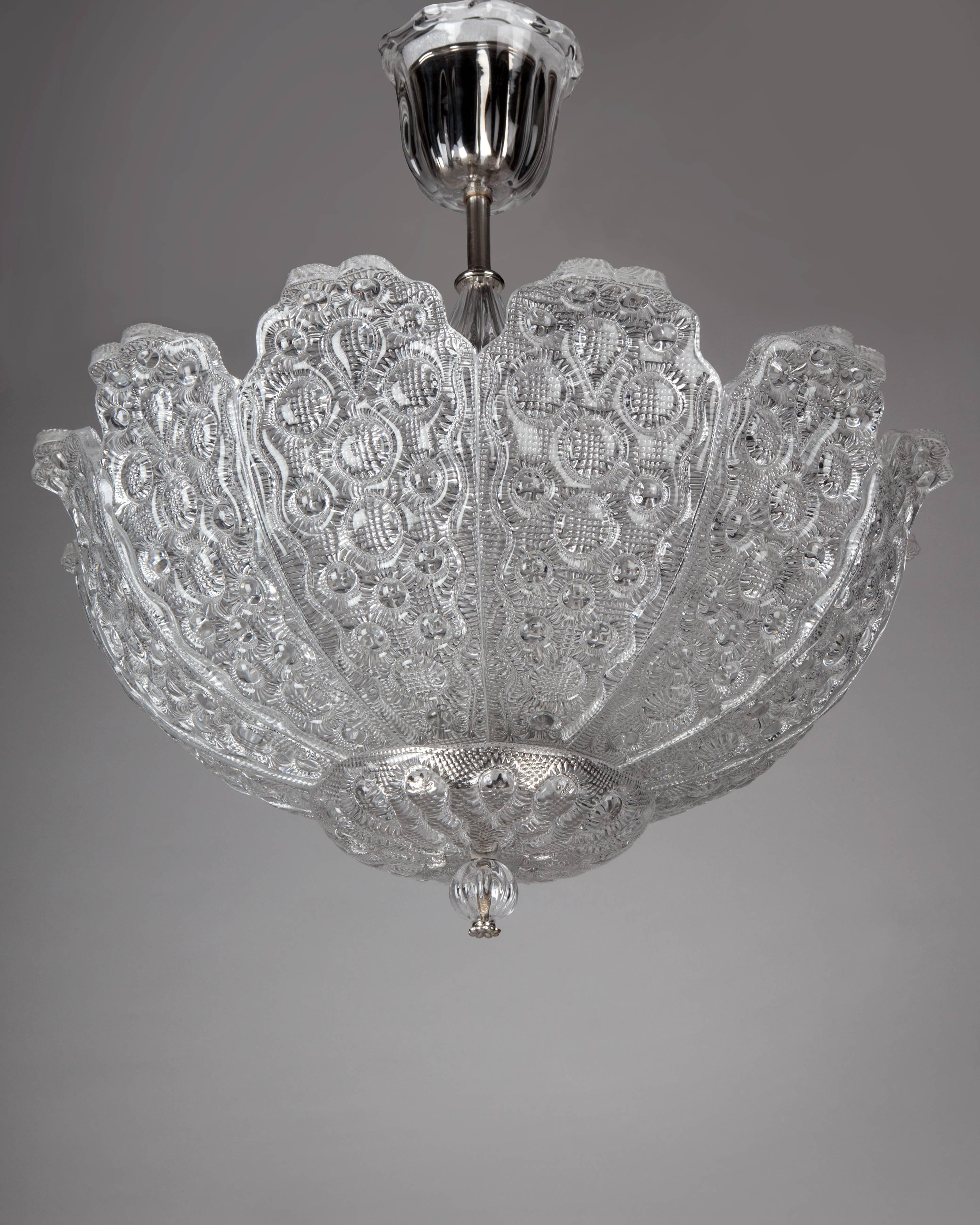 AHL4078

A vintage foliate-detailed glass chandelier with its original polished nickel fittings designed by Carl Fagerlund for the Swedish glassmaker Orrefors. Due to the antique nature of this fixture, there may be some nicks or imperfections in