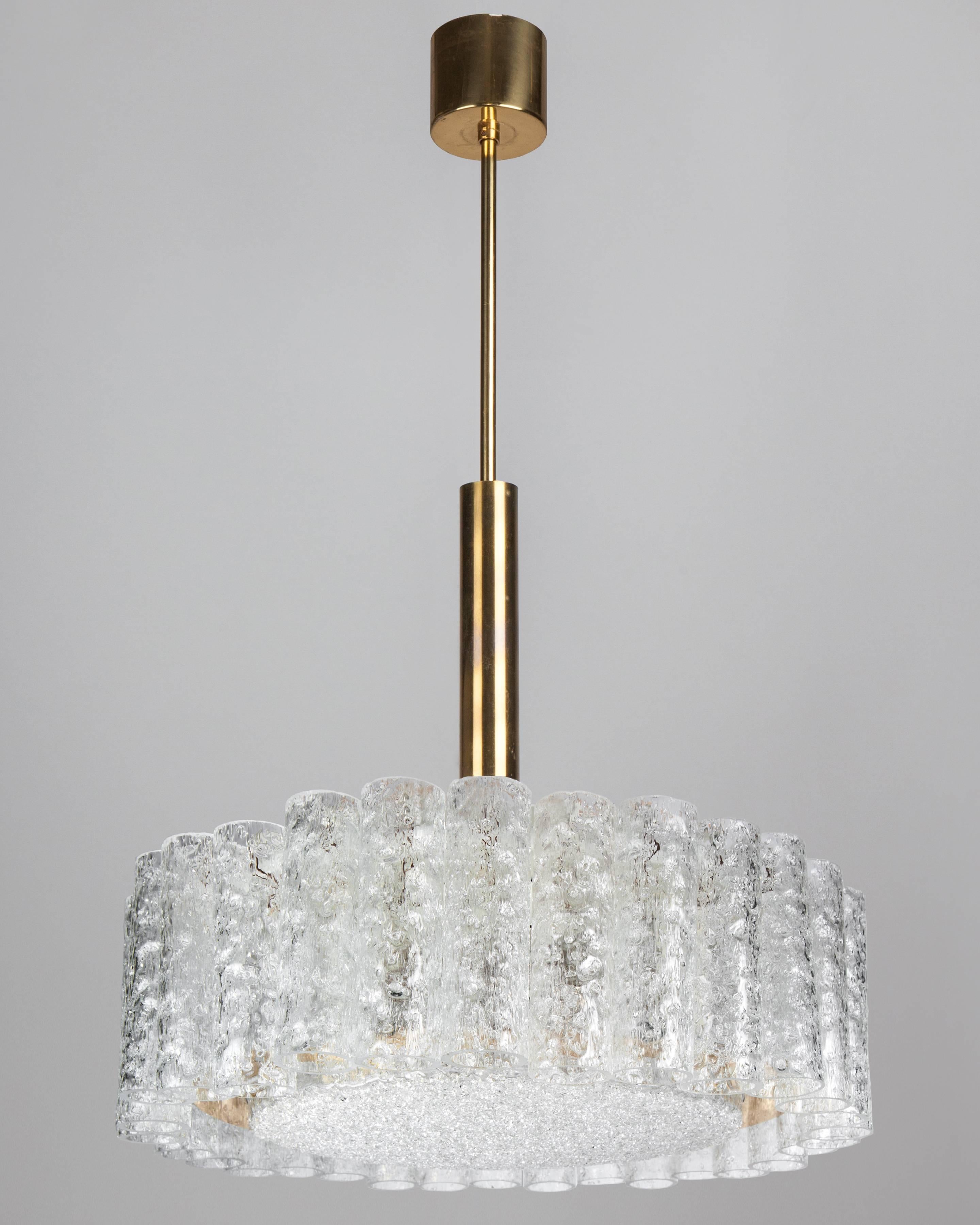 AHL4080
A vintage pendant with cylindrical skirting around a central disc lens. The metalwork in its original bright brass and white lacquer finish. By the German maker Doria. Due to the antique nature of this fixture, there may be some nicks or