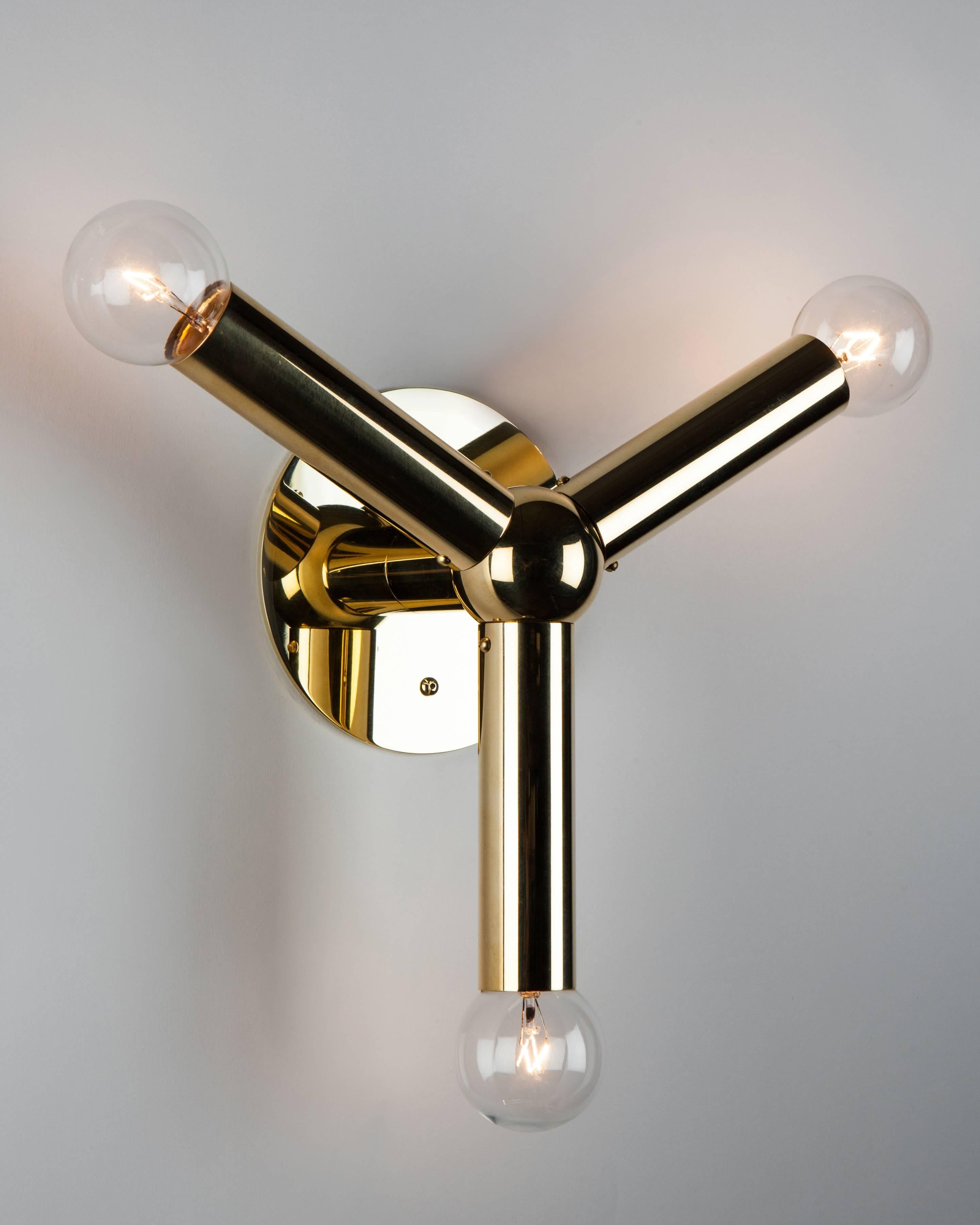 HWL6125
This mid-century modern style Molecule Wall Sconce has a simple minimal arrangement of a solid brass sphere and three round bar arms, each ending in a point of light, individually crafted in solid brass and hand finished to a high polished