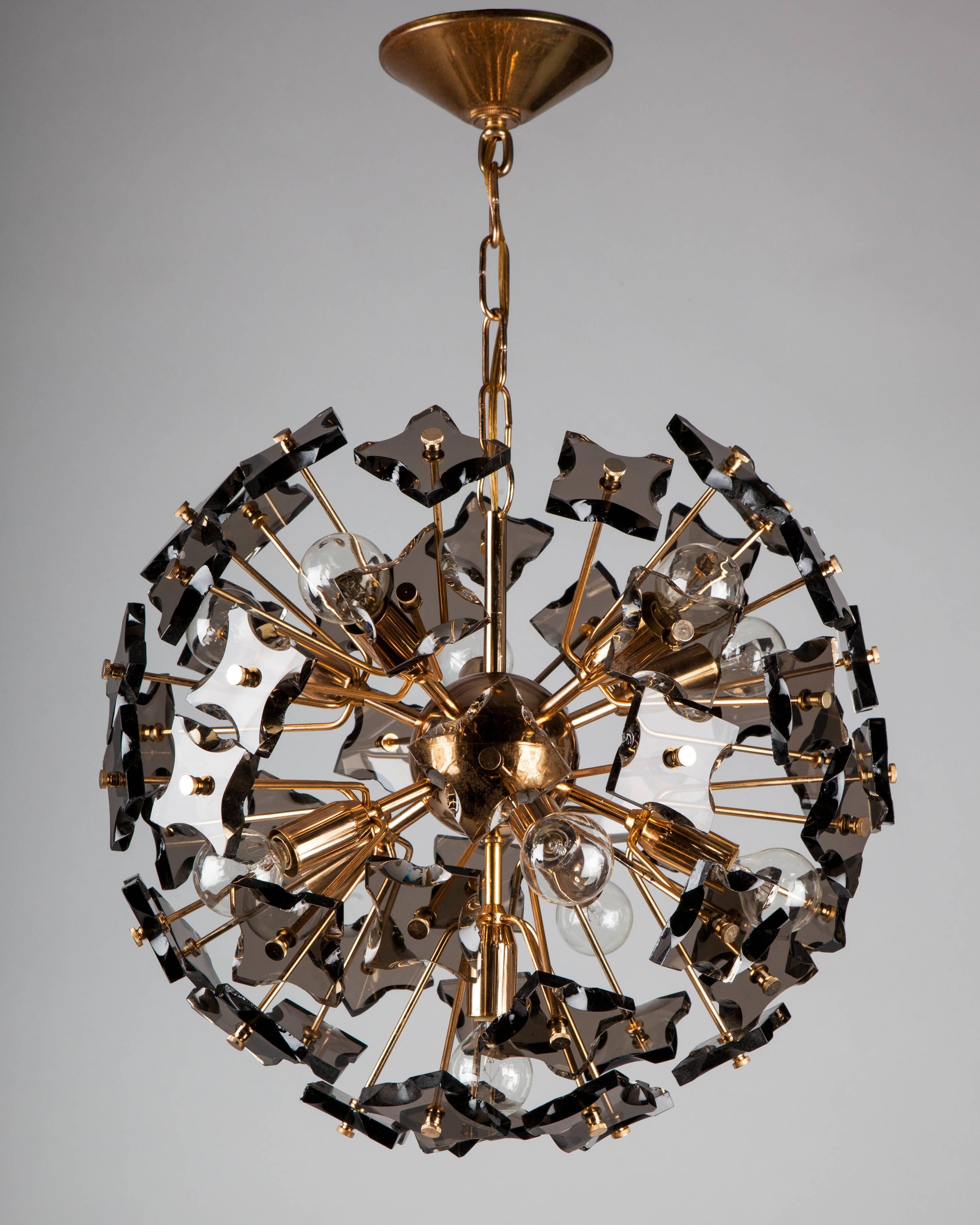 AHL4096
A vintage sputnik form chandelier with smoke glass elements in its original warm rose gold finish. Attributed to the Italian maker Fontana Arte. Due to the antique nature of this fixture, there are some nicks or imperfections in the