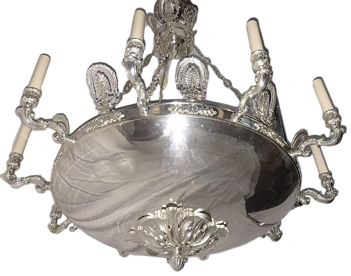 Pair of French circa 1920's silver-plated light fixtures with ten lights each. Sold individually. 

Measurements:
Diameter: 32