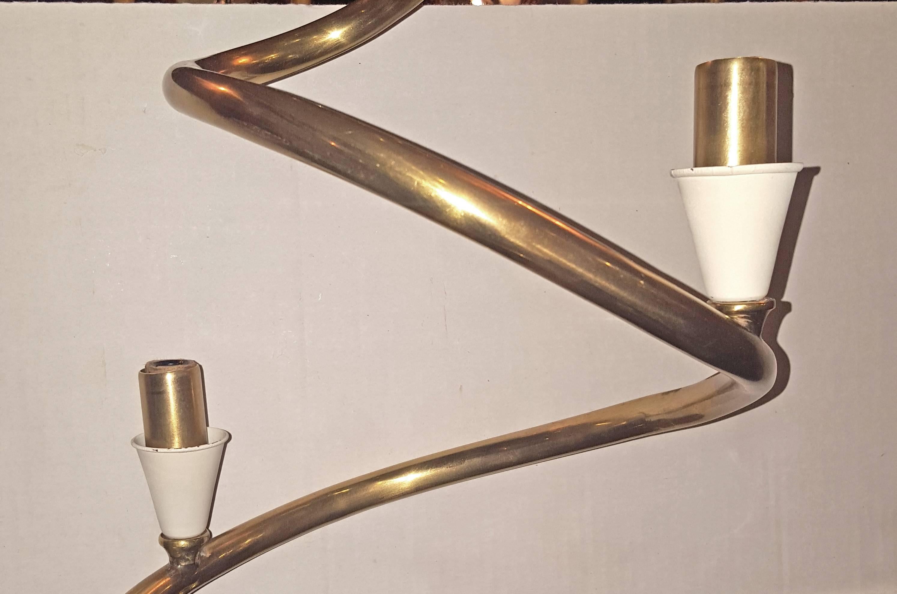 A pair of Italian circa 1960's moderne style spiral chandeliers with 12 lights, gilt and painted finish. Sold individually.

Measurements:
Diameter: 49