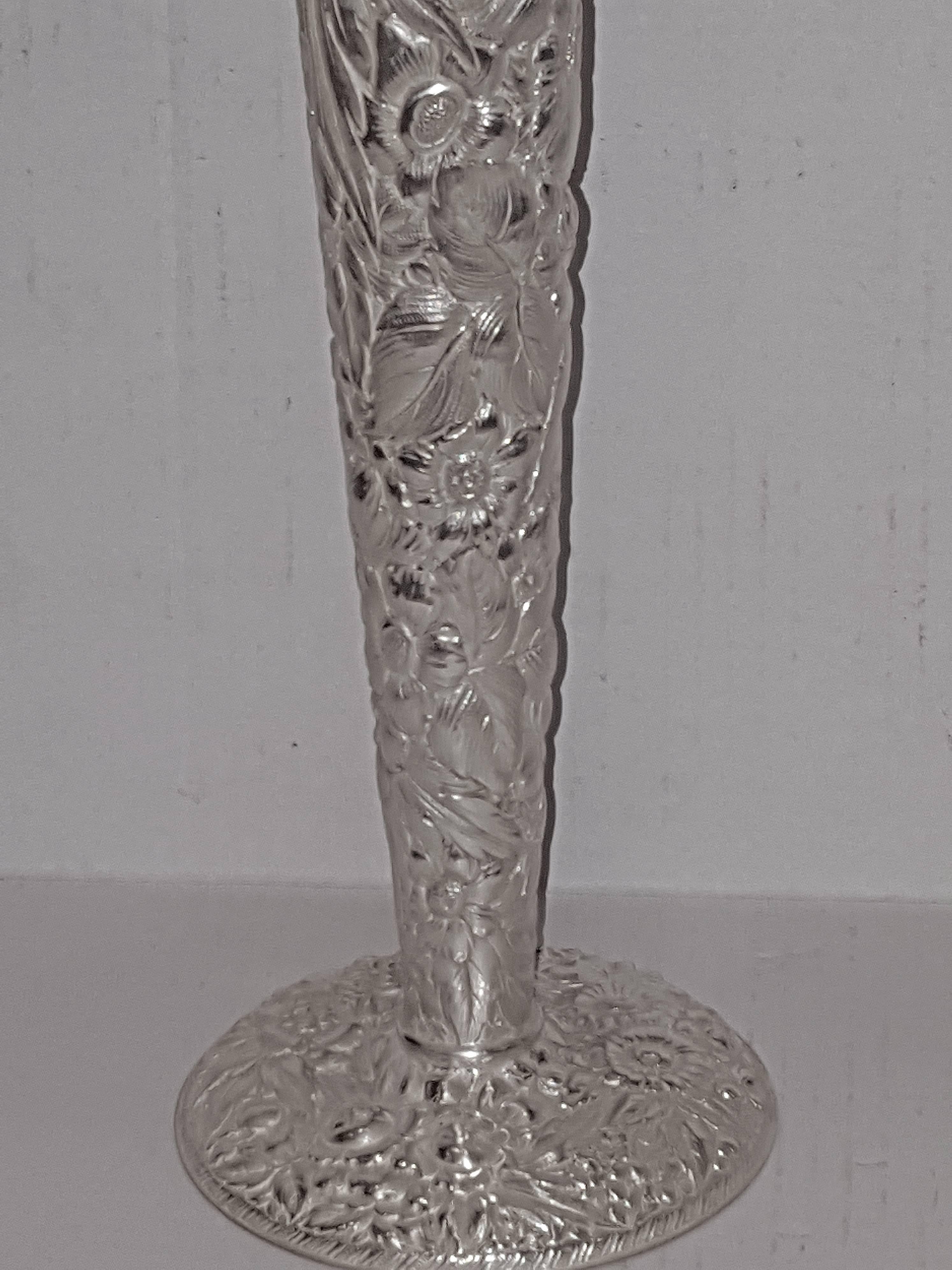 Pair of 1900s silver plated vases with very detailed floral decoration.

Measurements:
18