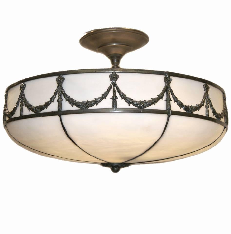 A circa 1930's French leaded glass pendant light fixture with six interior chandelier sockets.

Measurements:
Drop: 10