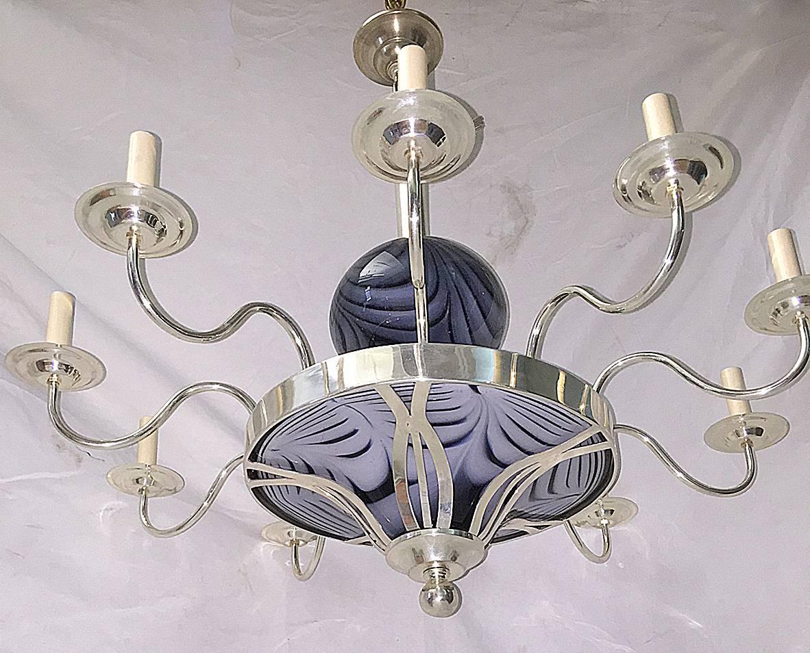 A circa 1920's Italian silver-plated 10-arm chandelier with black and white art glass elements.

Measurements:
Diameter: 38