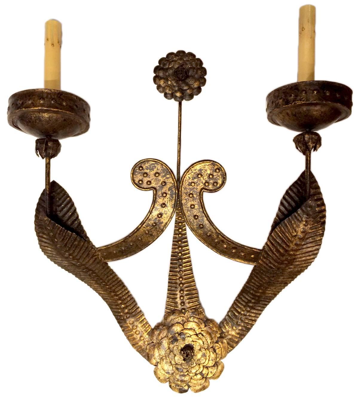 A pair of circa 1940s Italian gilt iron double light sconces with flower detail.

Measurements:
Height 22