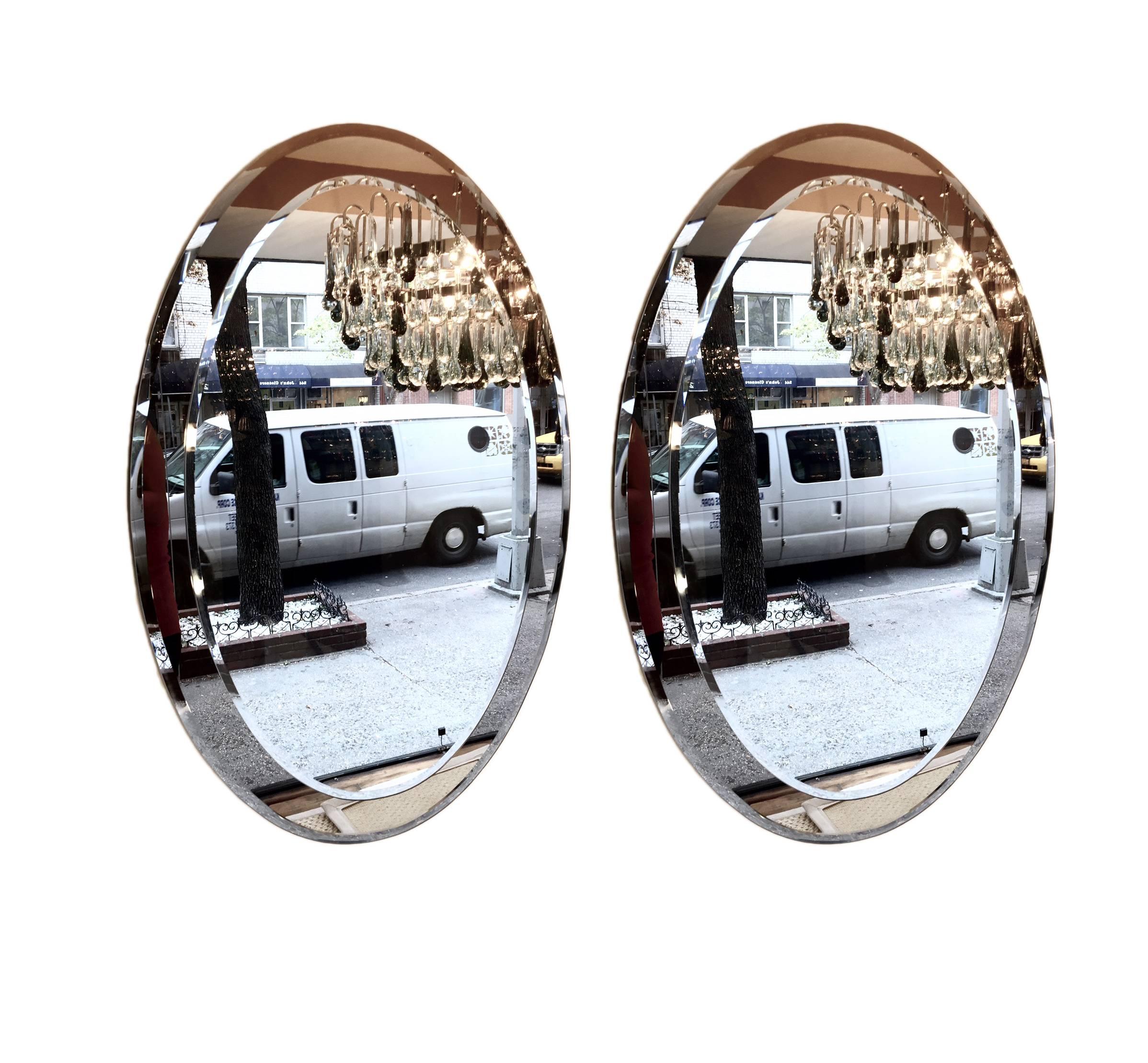 A pair of circa 1960's Italian gray framed mirrors in oval shape. Frame in a smokey gray tone. Sold individually.

Measurements:
Height: 36