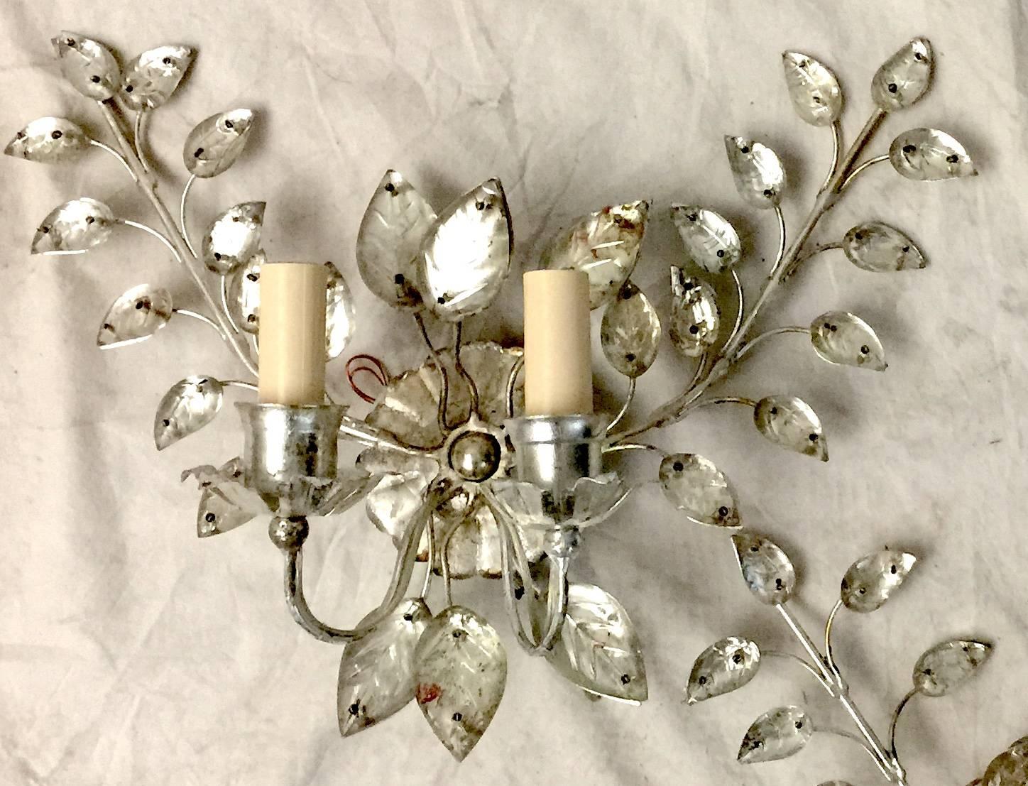 A pair of circa late 1940’s French silver-plated 2-light sconces with glass leaves.

Measurements:
Height: 11″
Width: 14.5″
Projection: 6″