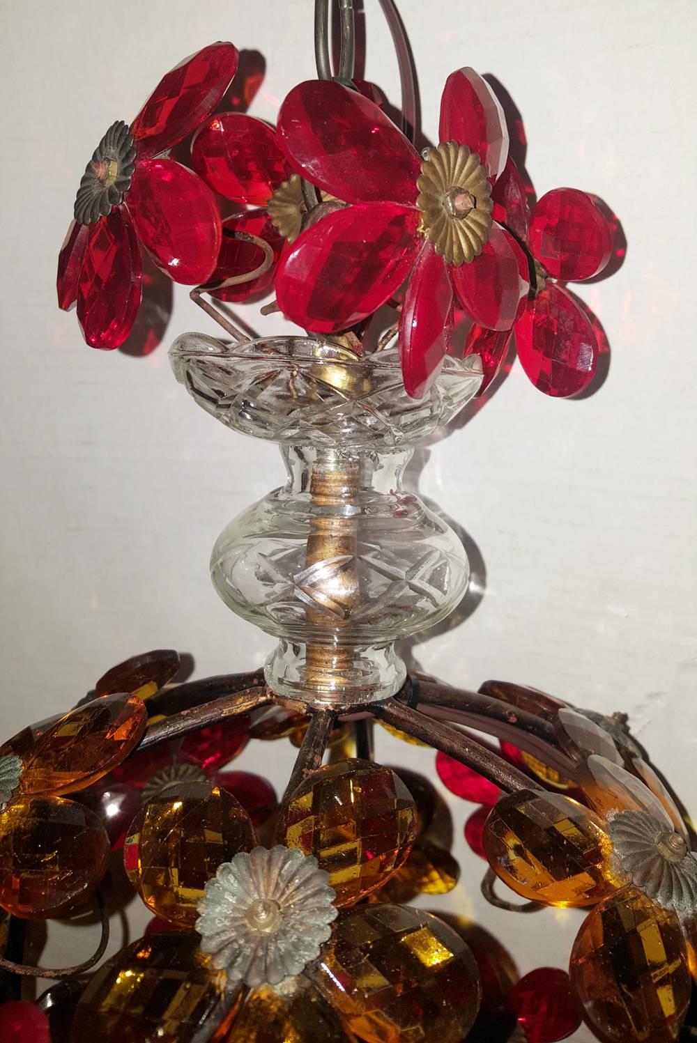 French, 1940s gilt metal light fixture with red and amber crystal flowers with three candelabra interior lights.

Measurements:
Diameter: 11