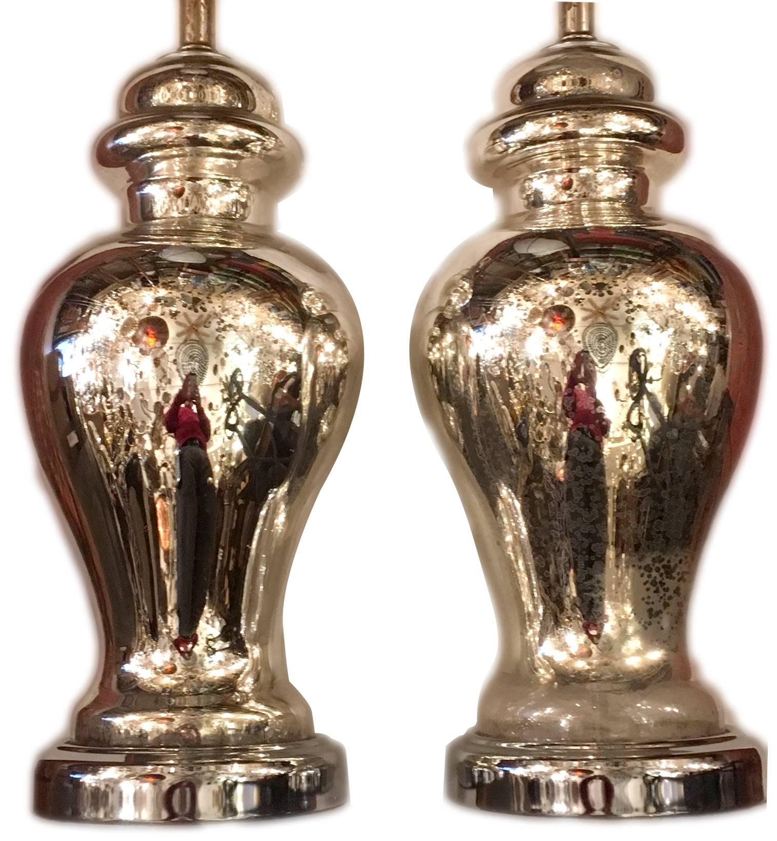 Pair of circa 1930s French mercury glass lamps.

Measurements:
Height of body 18