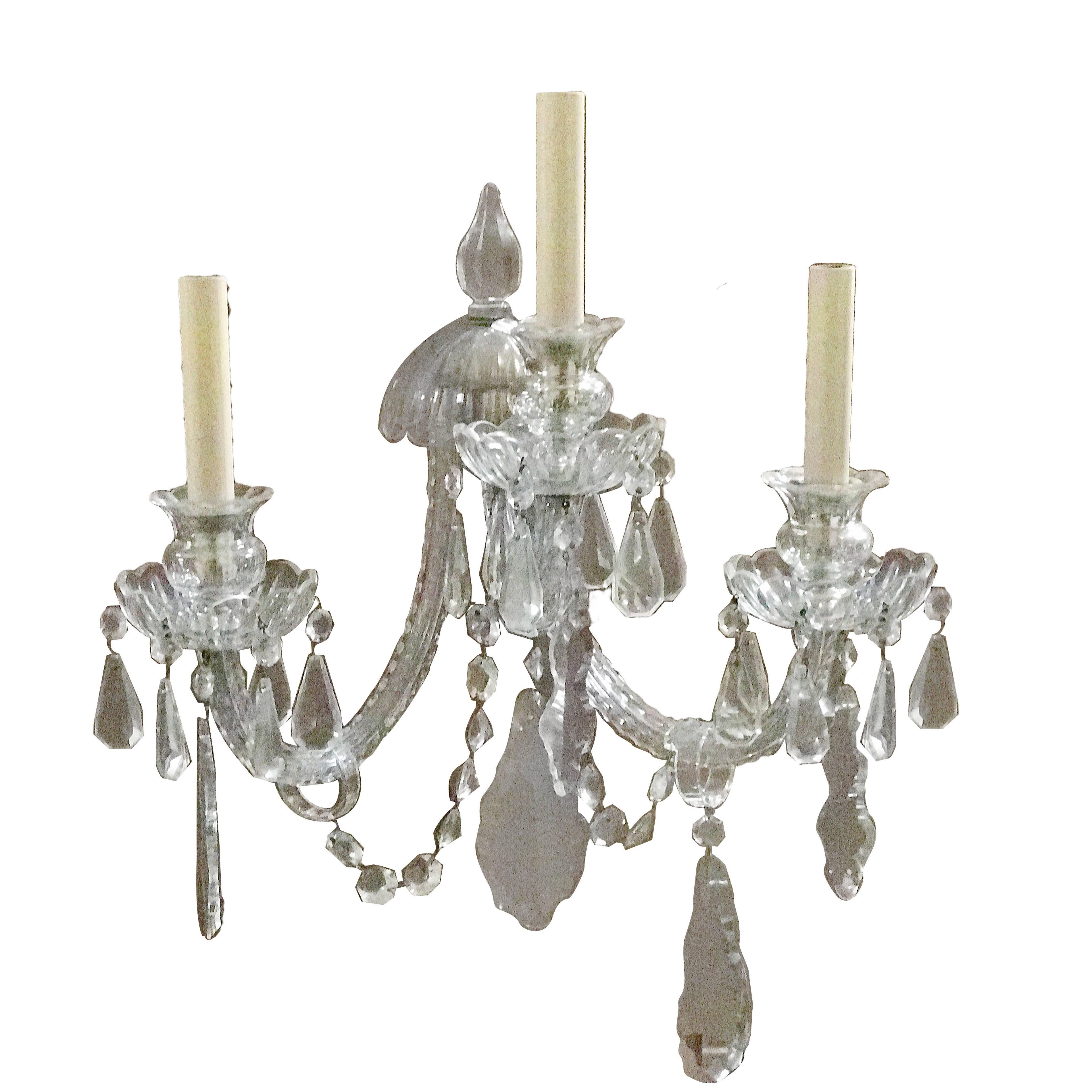 Pair of three-light cut crystal sconces with pendants.