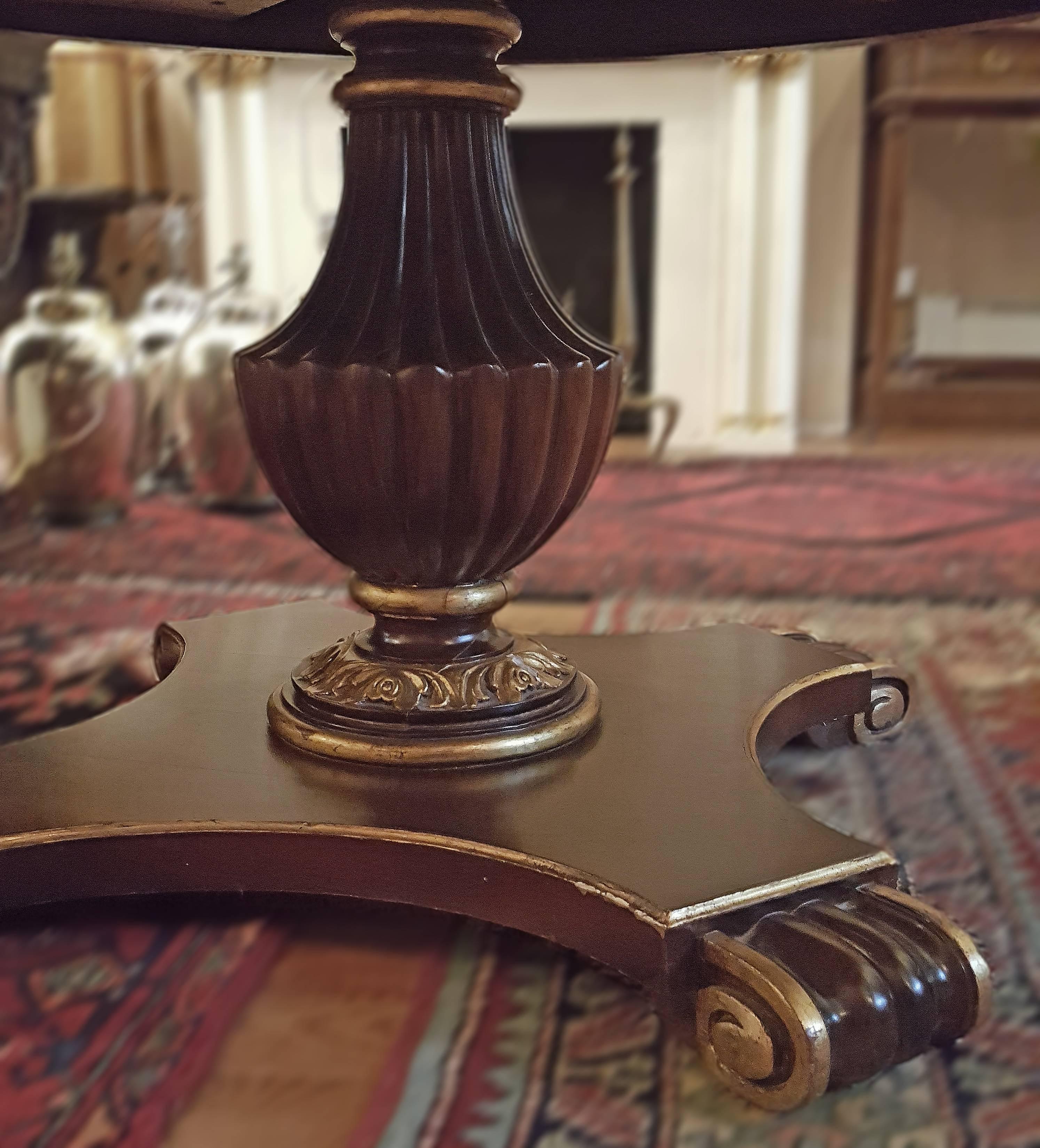 Italian table with gilded details on body, circa 1940s. Urn shaped pedestal base.

Measurements:
55" diameter
29" height.