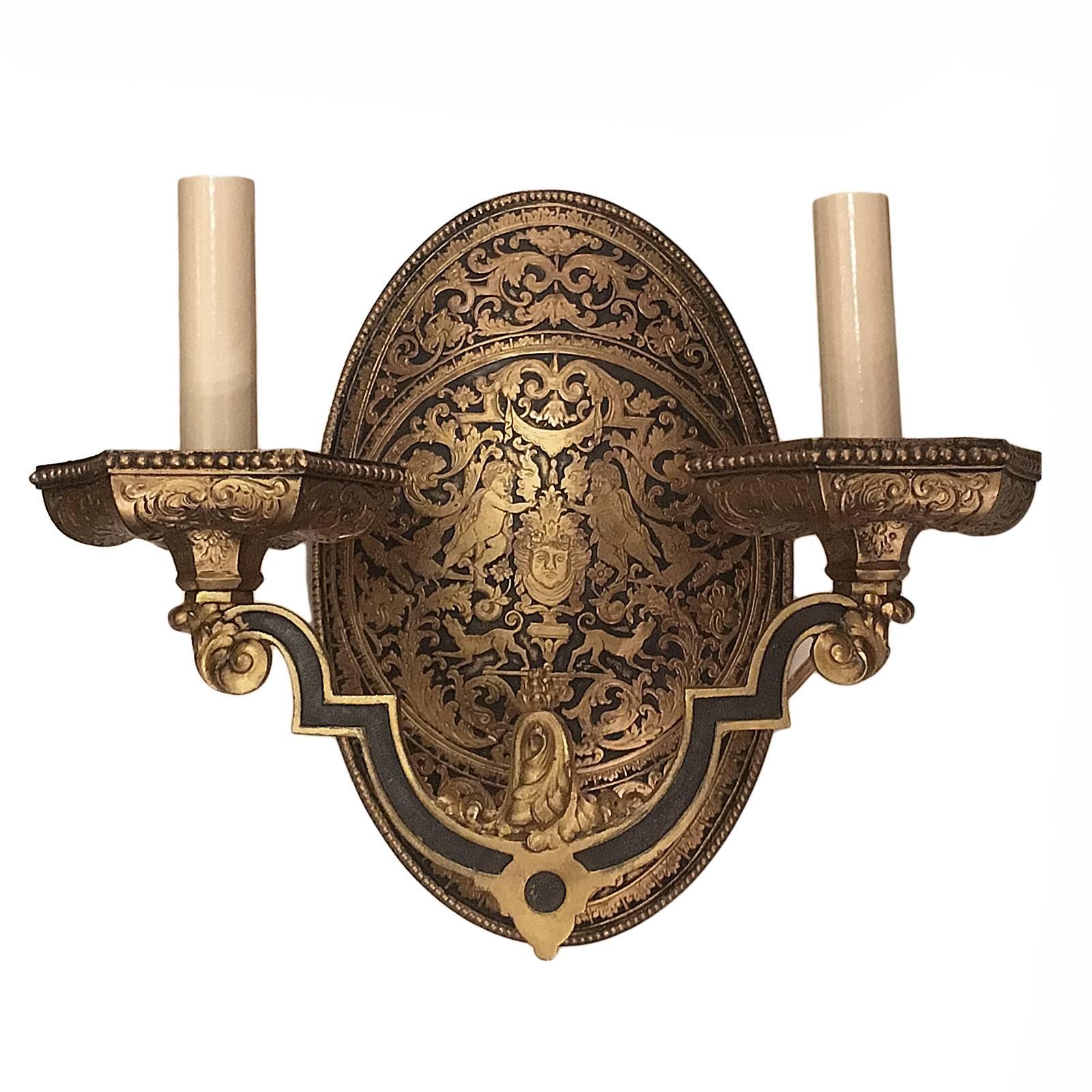 A set of four neoclassic style double light gilt sconces with original finish. Oval backplate with stylized foliage and arabesques, hounds and putti. The price is per piece. Sold in pairs. 

Measurements:
Height 14 in.
Depth 5.5 in.
Width/length 12