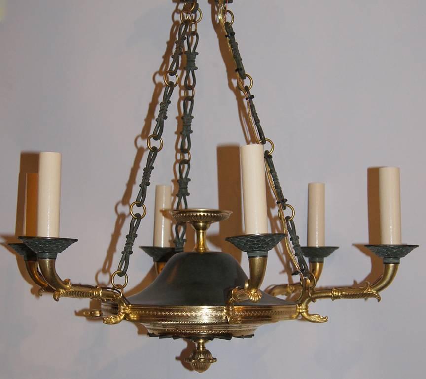 A 19th century French Empire style chandelier with original verdigris and gilt finish. Six arms

Measurements:
20.5