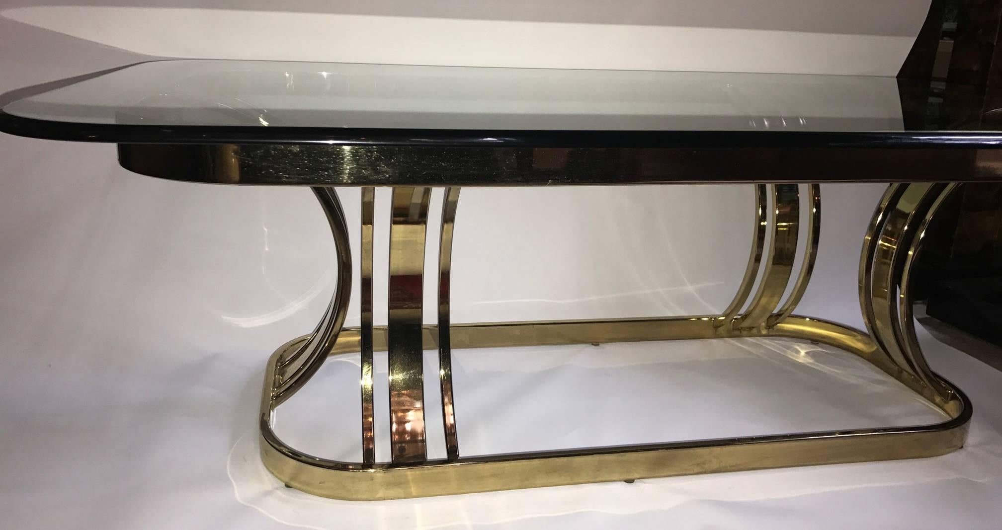 A circa 1970's Italian gilt coffee table with glass top.

Measurements:
Height: 16.5