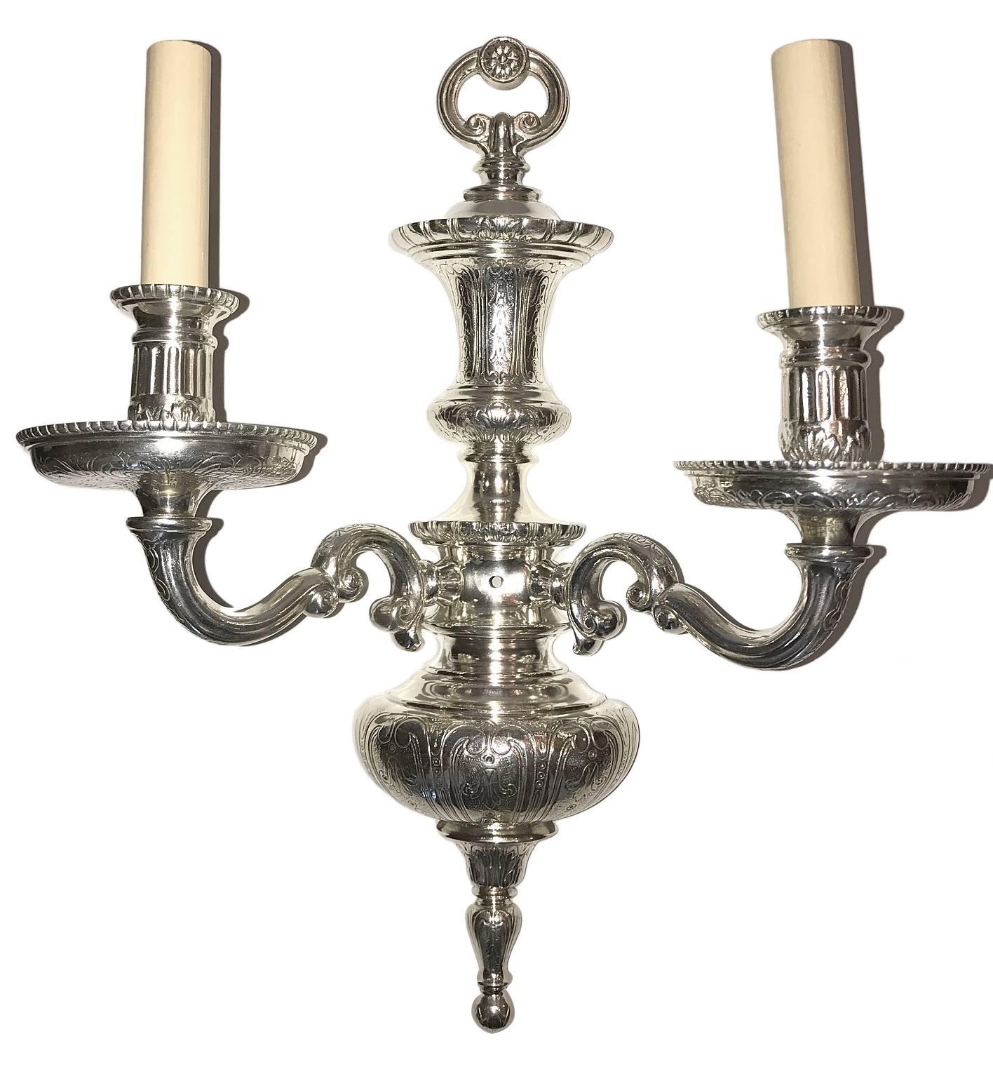 Pair of 1920s silver plated double light sconces with etched body.

Measurements
Height: 16.5