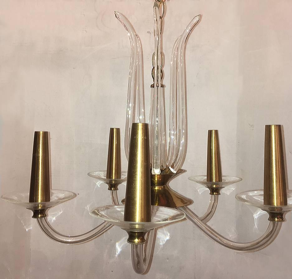 A circa 1960's moderne style French blown glass and gilt metal chandelier.

Measurements:
Diameter: 22