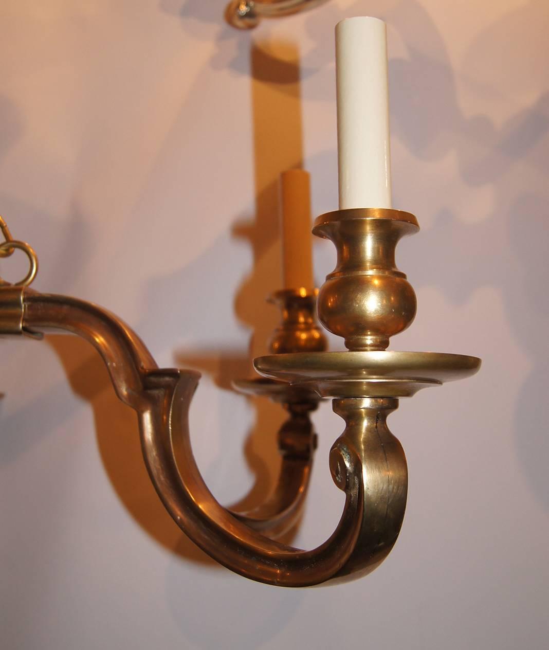 Horizontal gilt bronze chandelier with eight lights, gilt finish, circa 1940. 

Measurements:
41.75