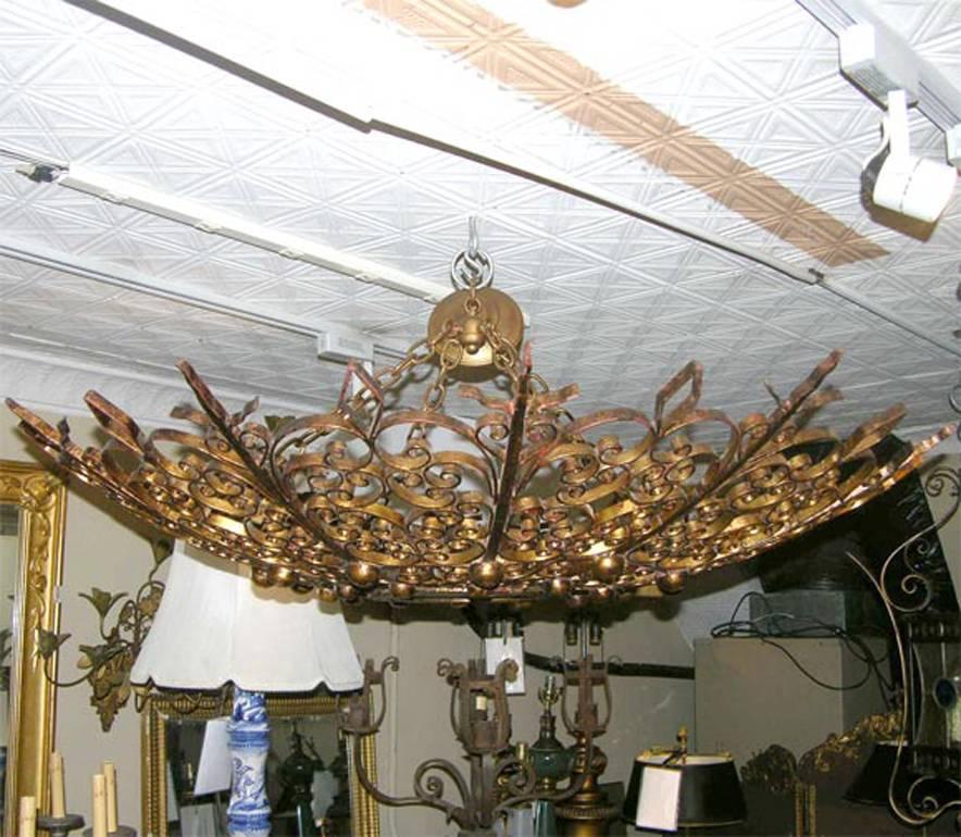 French Pair of Large Gilt Iron Sunburst Light Fixtures For Sale