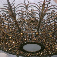 Pair of Large Gilt Iron Sunburst Light Fixtures