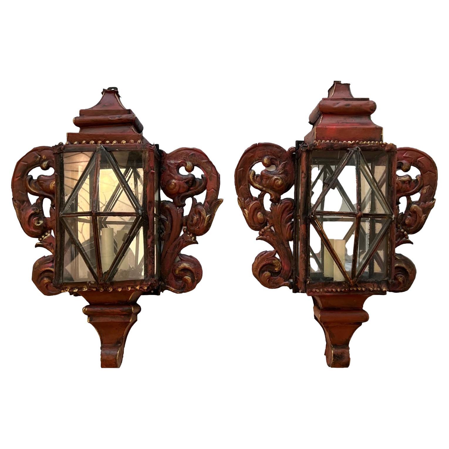 A pair of large circa 1900 Venetian painted tole lantern sconces with glass panels, original finish and patina.

Measurements:
Height: 24