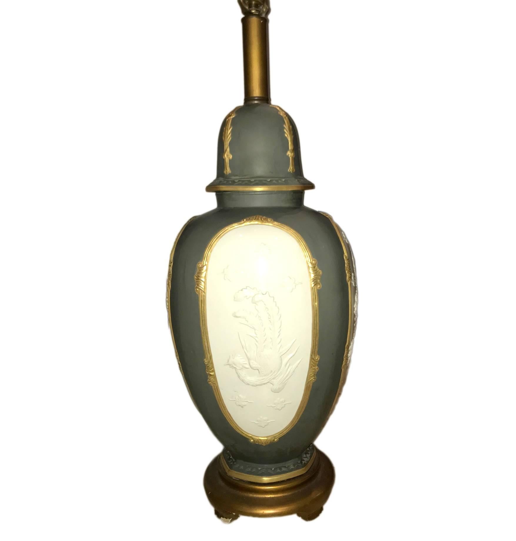 A large single French chinoiserie porcelain table lamp with gilt details and Chinese Dragon medallion decoration.

25