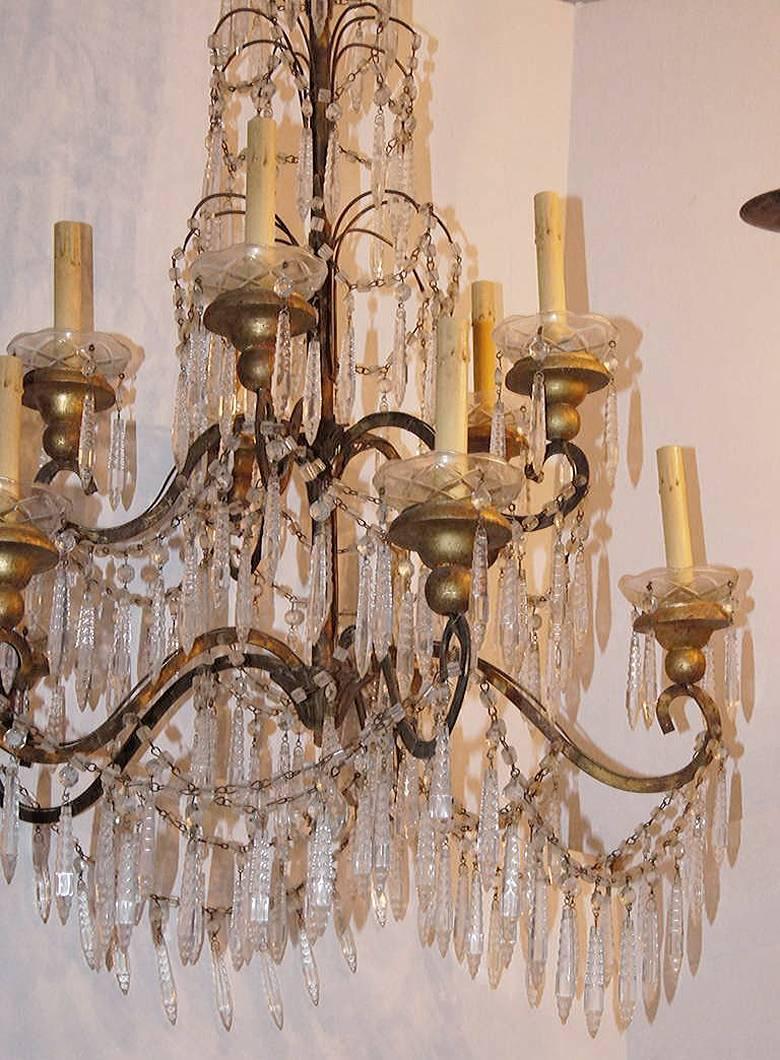 A late 19th century Italian gilt metal chandelier with crystal pendants, ten lights. 

Measures: 43