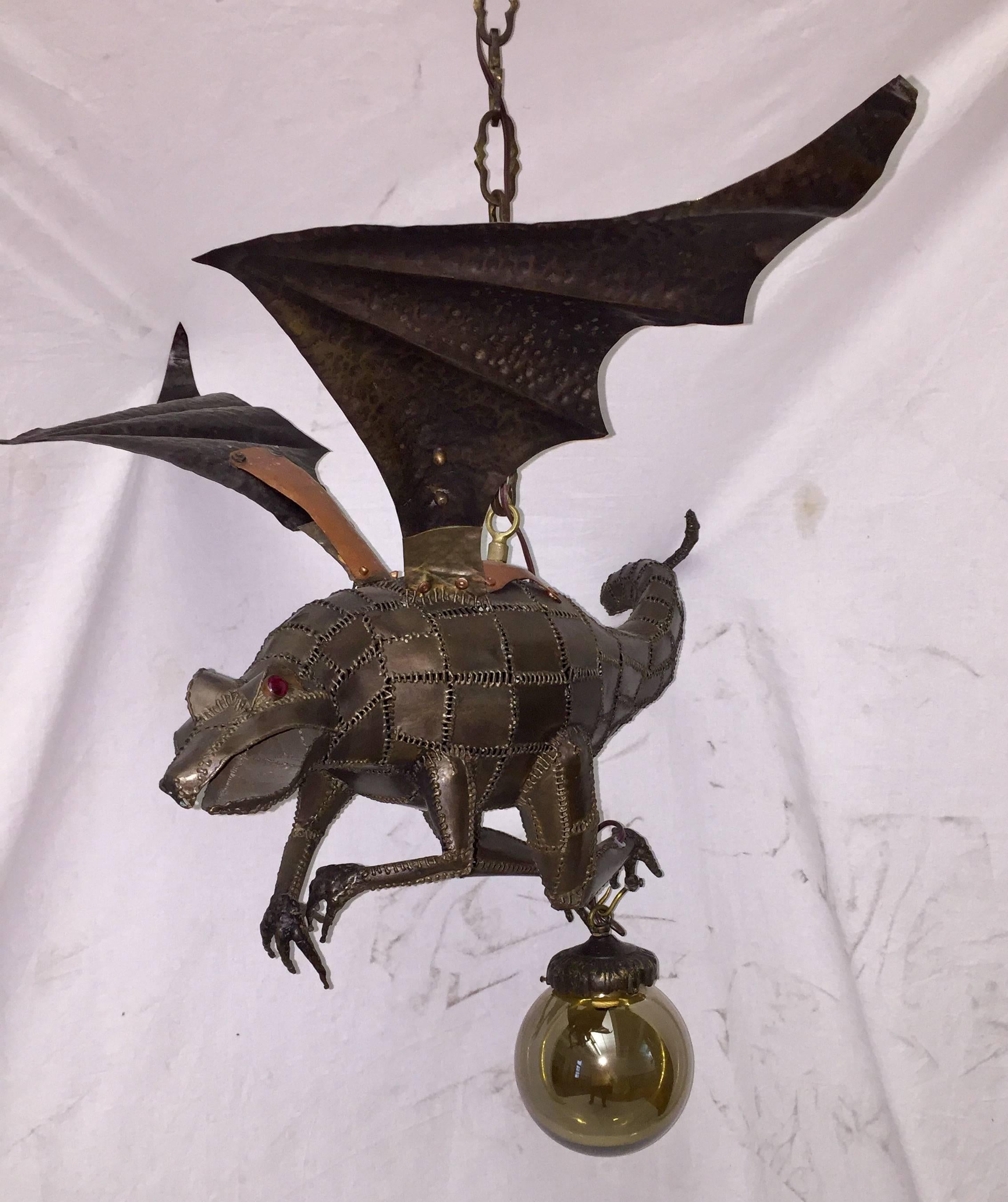 A circa 1970's Italian iron dragon lantern shaped light fixture with etched glass globe. 

Measurements:
Minimum drop: 34